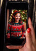 Phone screen showing a guest transformed into an elf with Gala Boss AI Holiday Experience