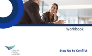 Image of woman talking to person at work
