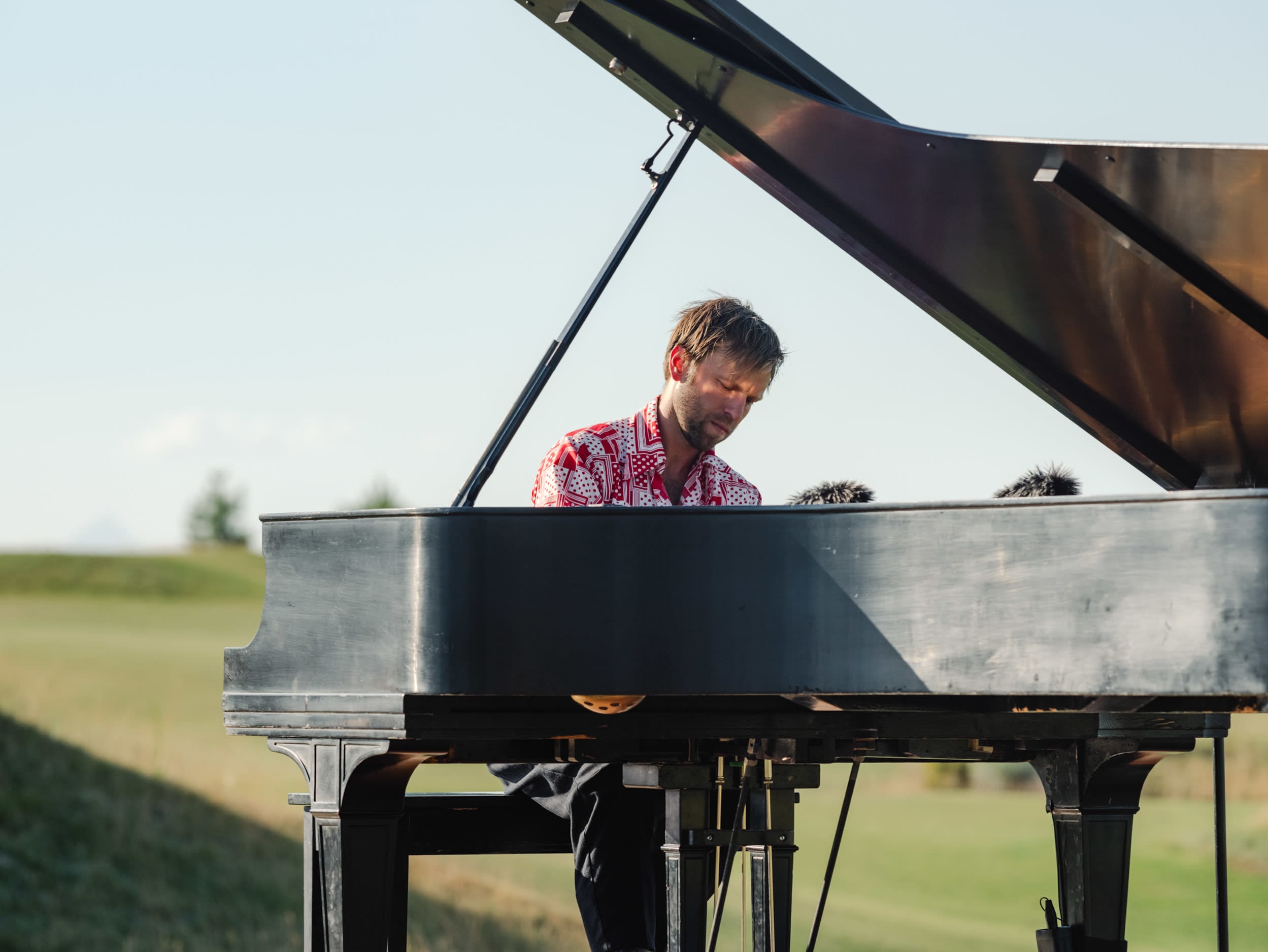 A closeup of Hunter Noack at a piano