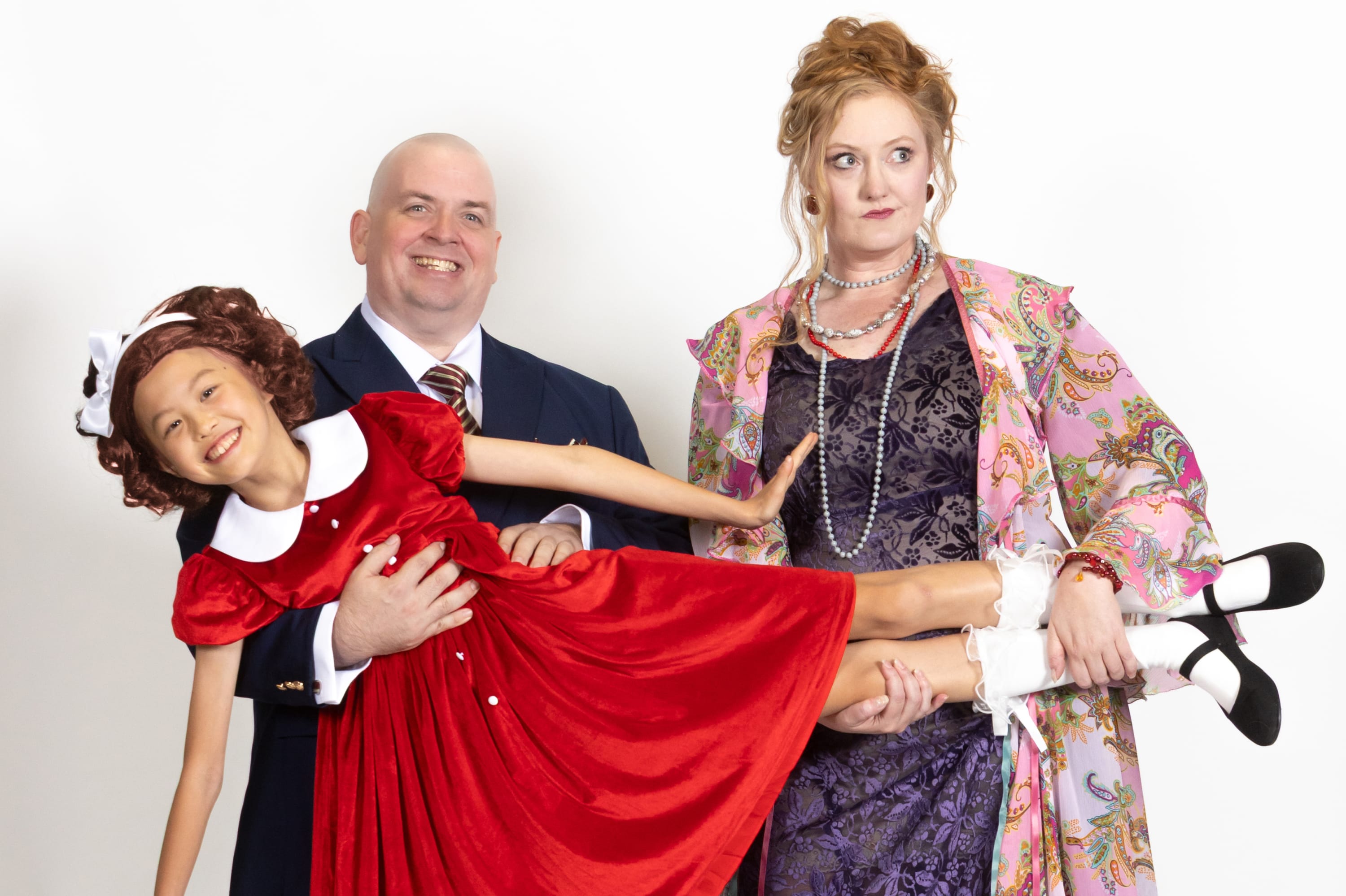 Oliver Warbucks, Annie, and Miss Hannigan in ANNIE