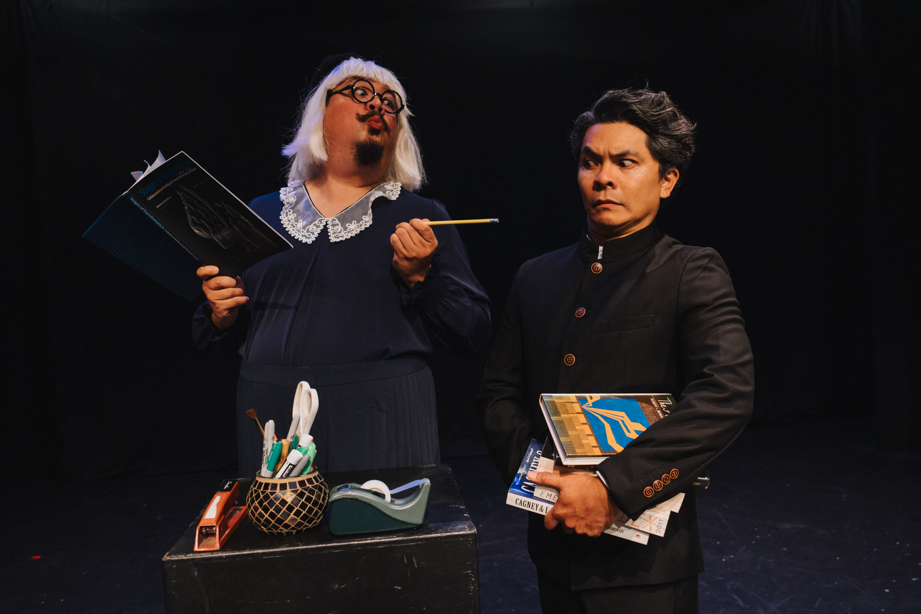 L-to-R: Chuck Lacson, Jed Parsario The Librarian wants to make sure that the boy's books are not overdue. Photo by Robbie Swe