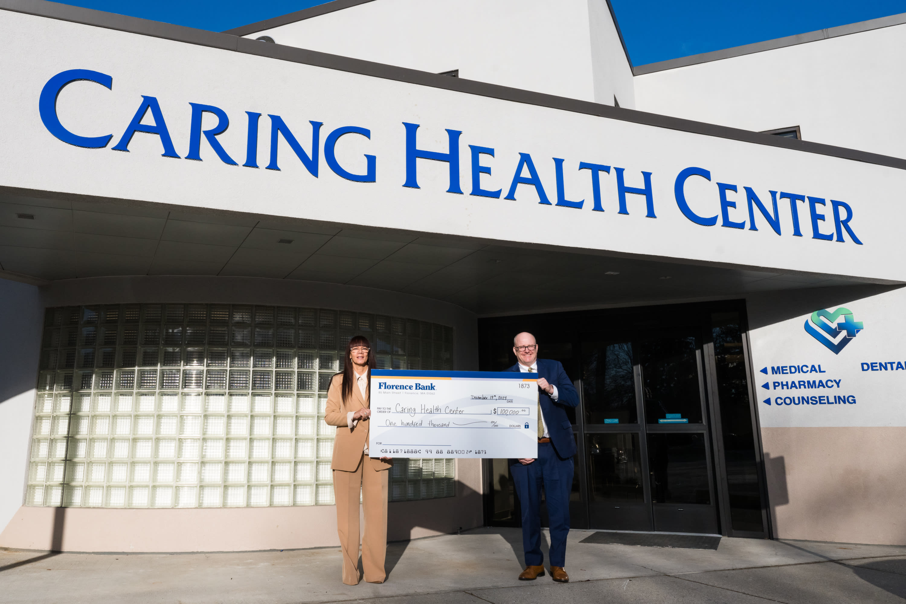 A photo of Tania M. Barber, president and CEO of Caring Health Center, and Florence Bank President and CEO Matt Garrity.
