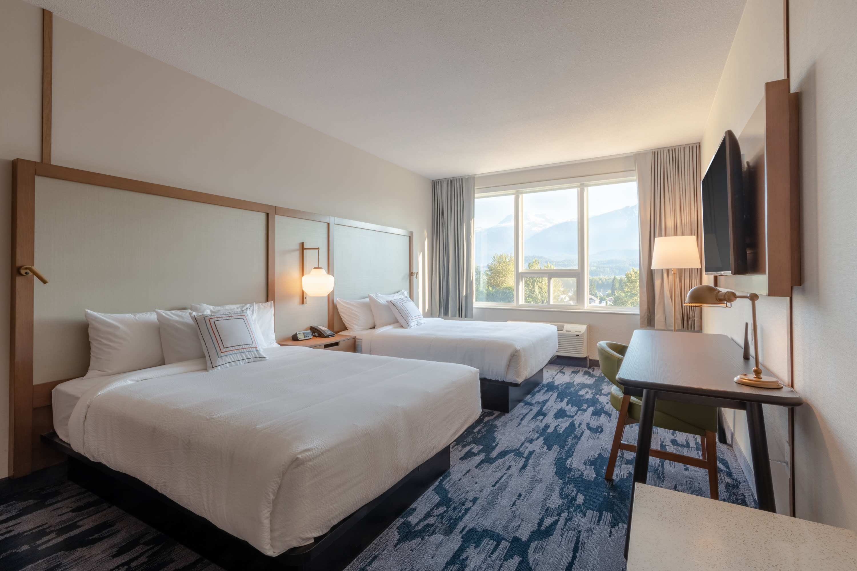 mountian view hotel room with two queen beds at the Fairfield by Marrott revelstoke