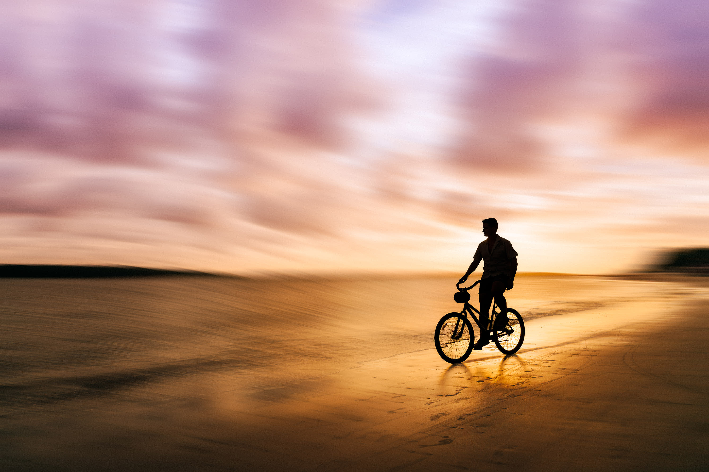 Biking at Sunset by Helena Goessens Photography.