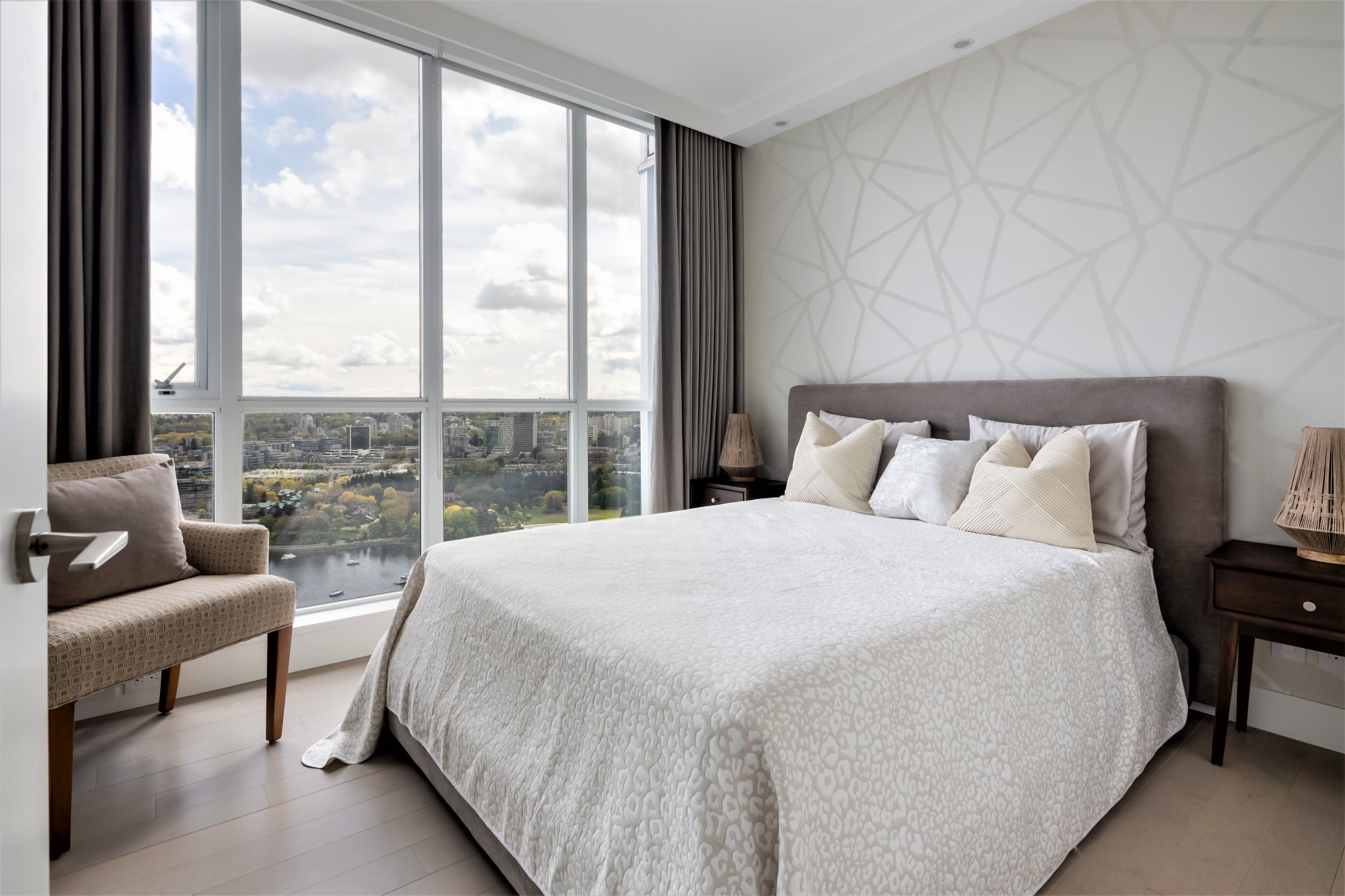 bedroom-renovation-textured-wallpaper-laminated-flooring-wood-nightstands