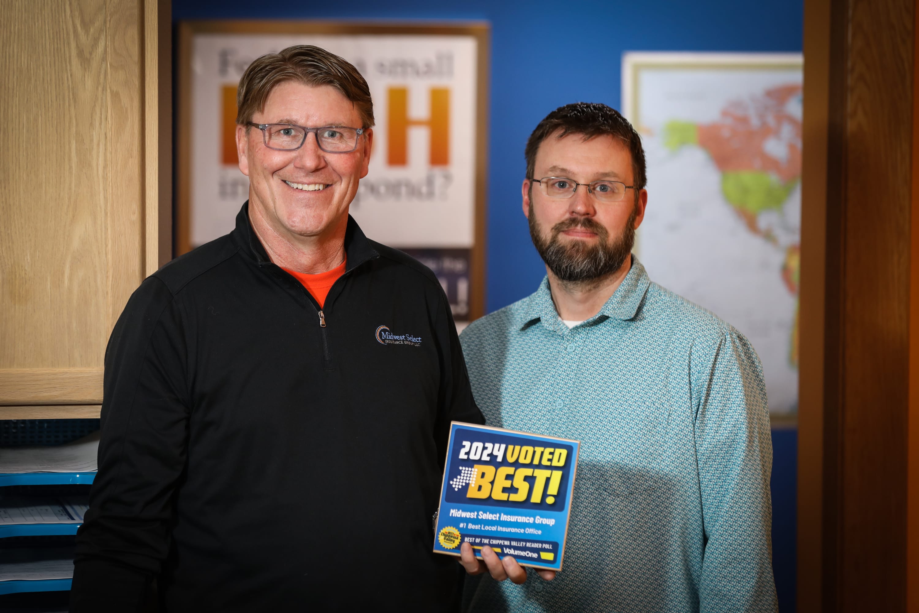 MSIG owners Chris Dooley and Steve Scullion holding Volume One's 2024 Best Insurance Office in the Chippewa Valley Award.