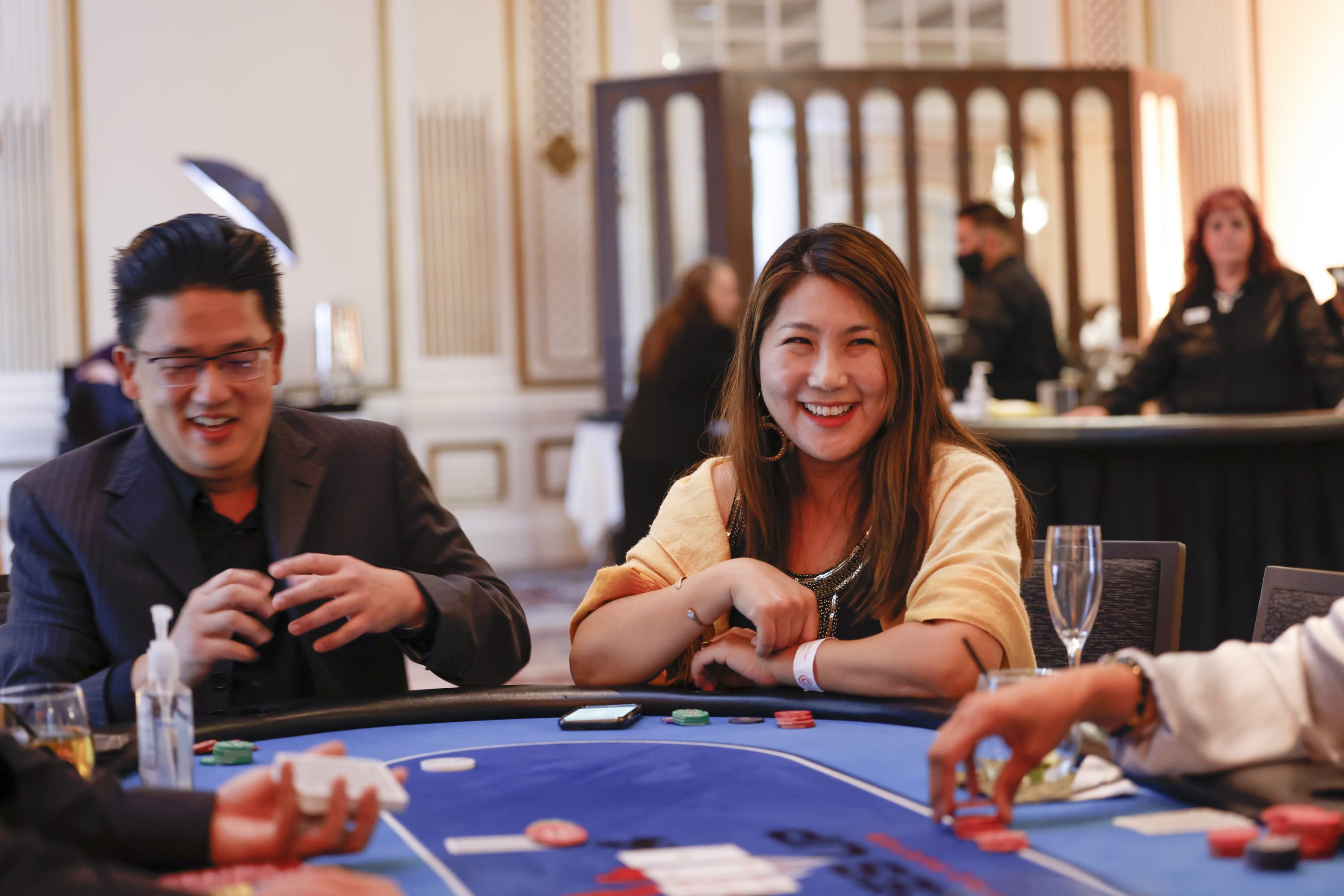 Players at a poker table playing texas hold'em