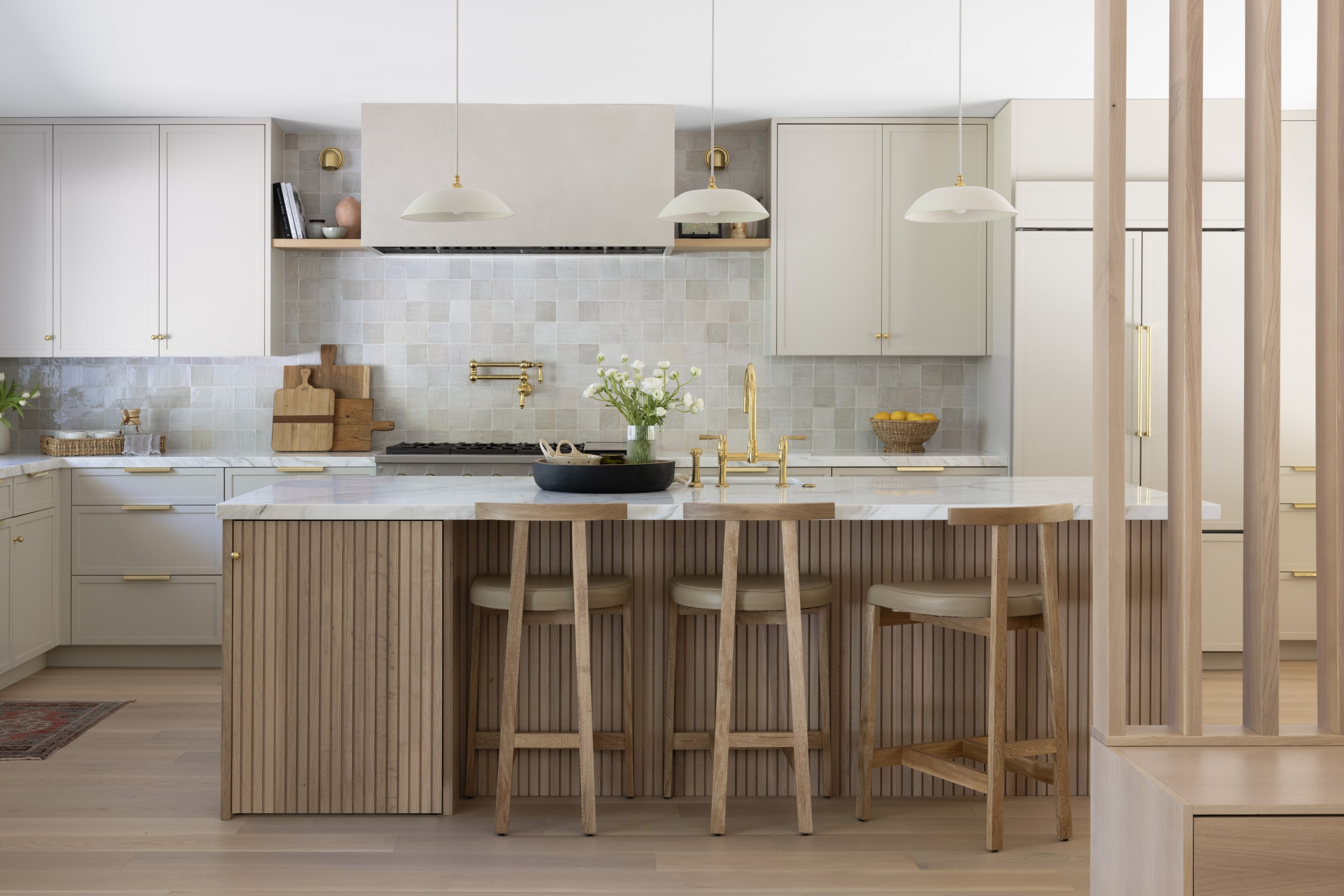 Light-filled kitchen remodel with organic modern cabinetry, brass hardware, and functional layout