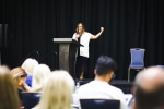 Georgette Pascale at podium during OLS 2025