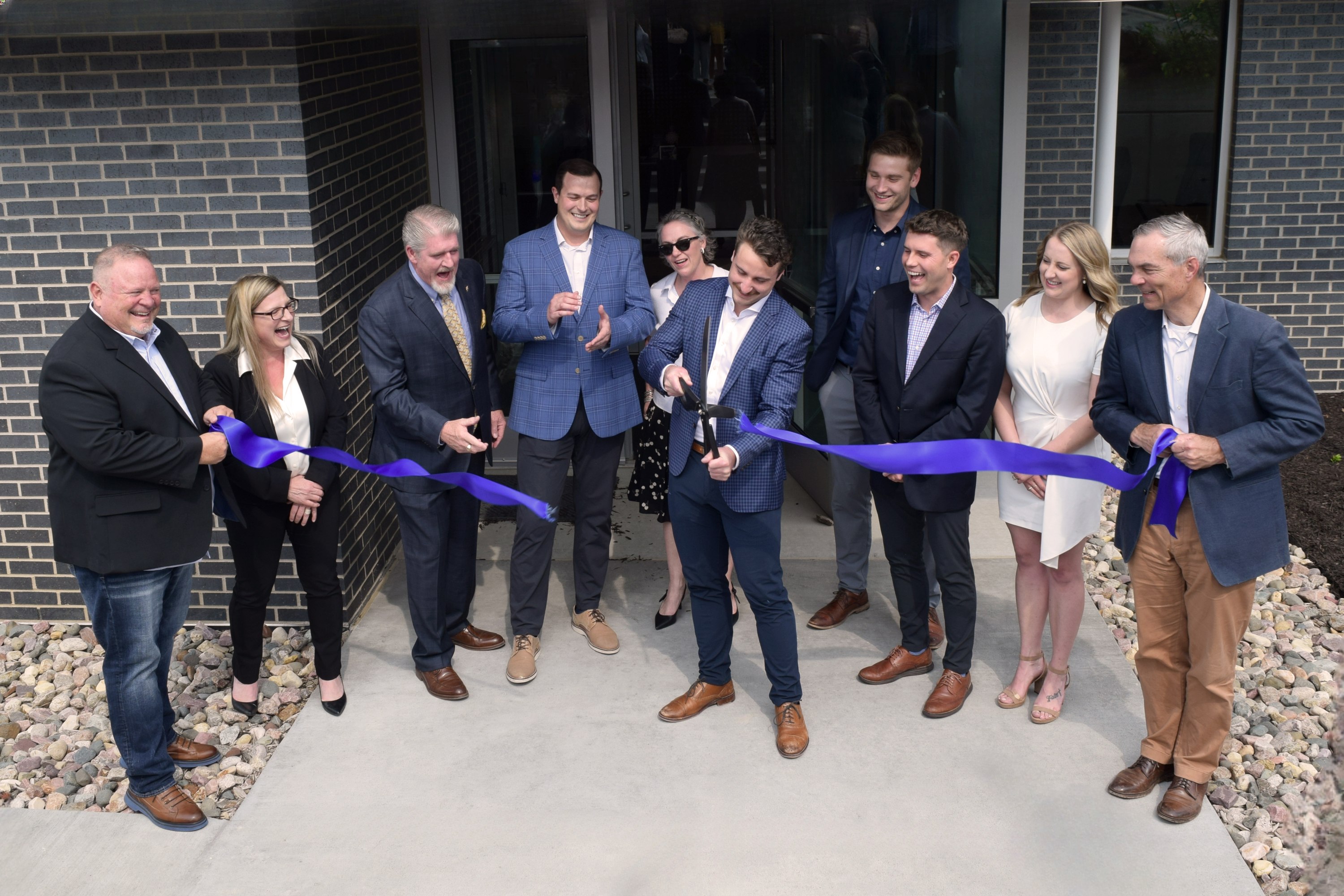 The Percipio Business Advisors team celebrates their official ribbon-cutting in conjunction with the Greater Omaha Chamber.