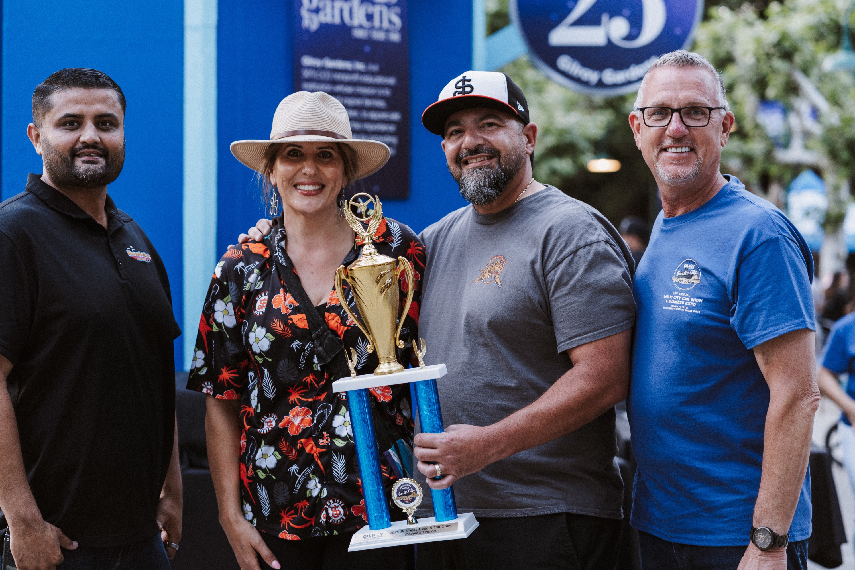Award recipient smiling with Gilroy Chamber backdrop at the Business Expo