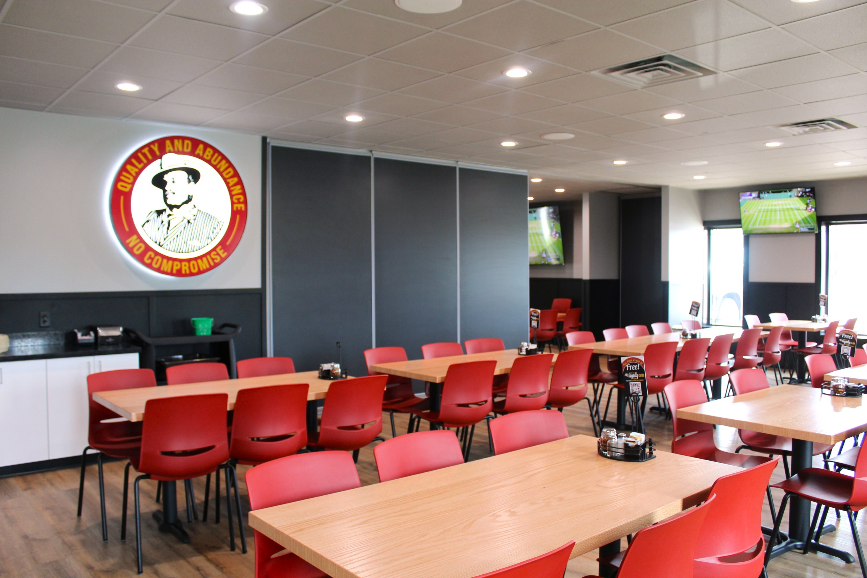 Co-workers enjoying their end of year party at Godfather's Pizza Party Room