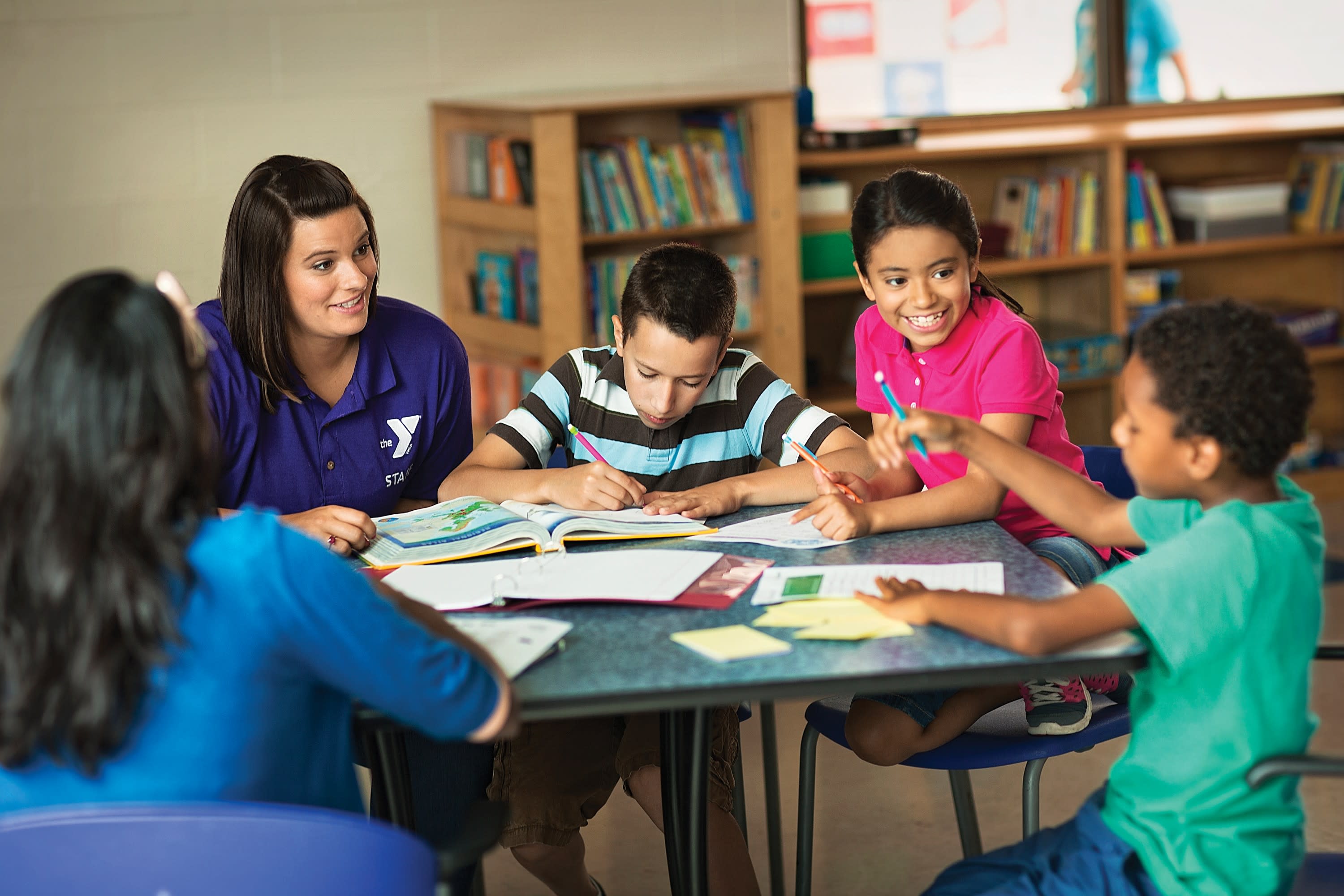 Work with youth in YMCA Community Outreach programs after school