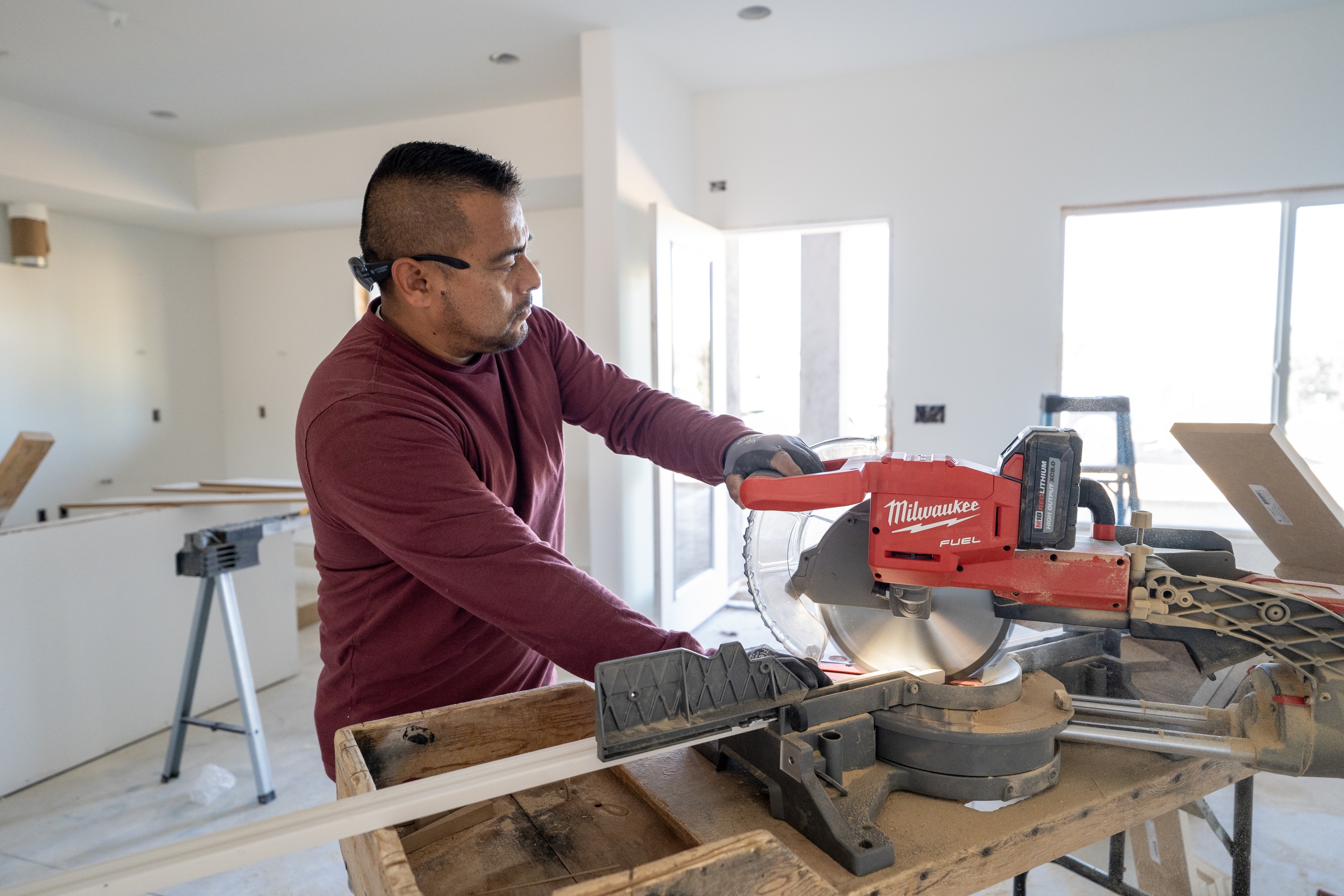 Expert installer EZ Meza cuts molding for a new home in Fallbrook.