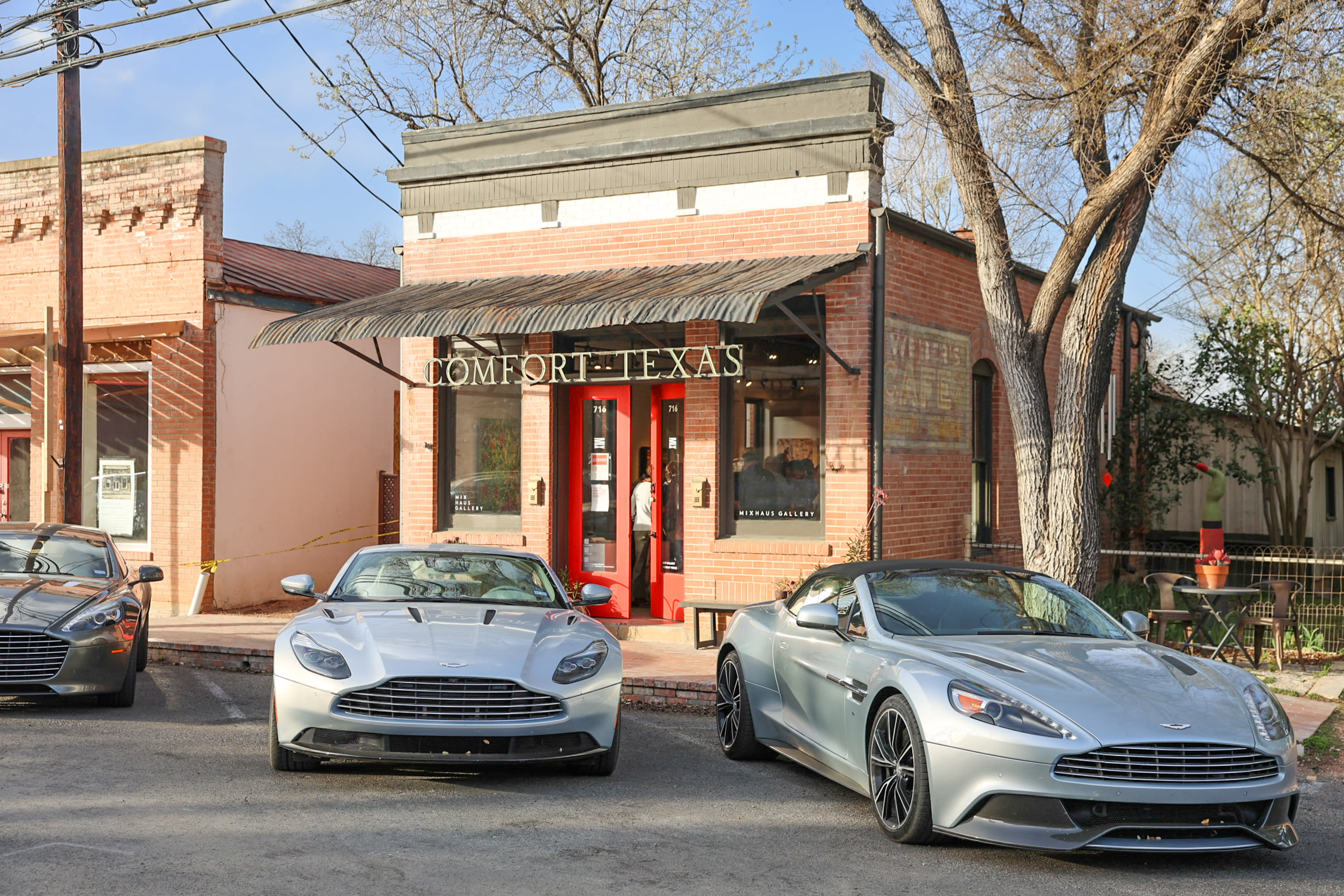 Aston Martins in front of Mix Haus Gallery