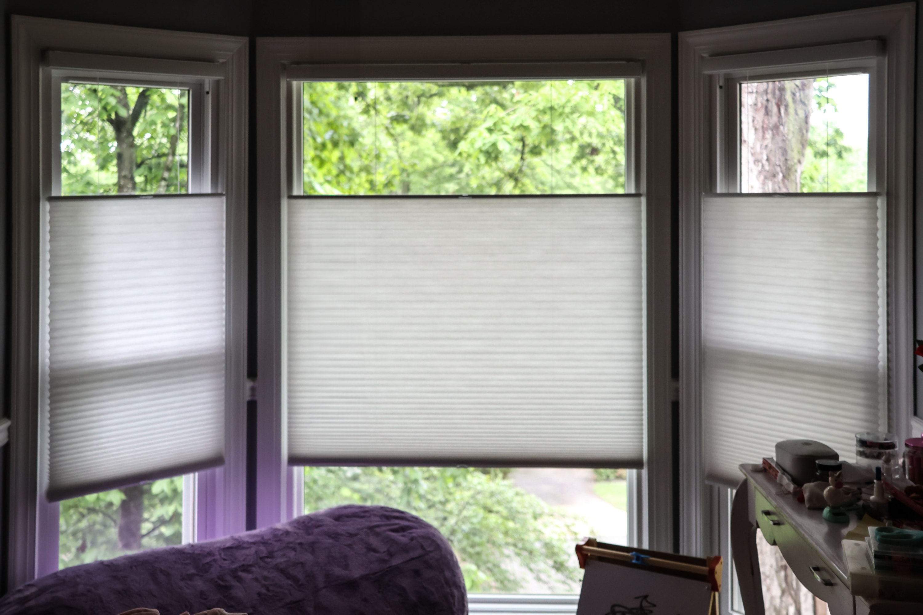top-down bottom-up honeycomb shades in three window alcove