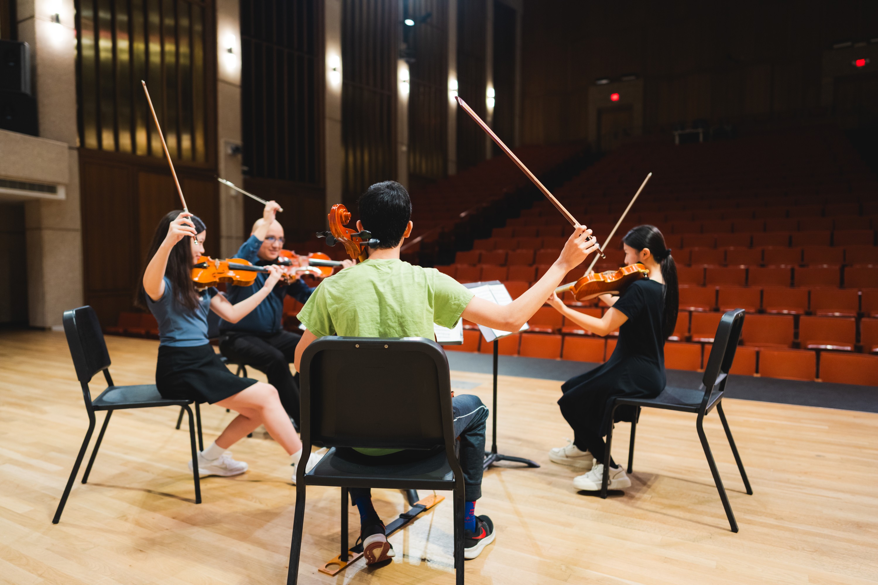 Students rehearsing with instructor