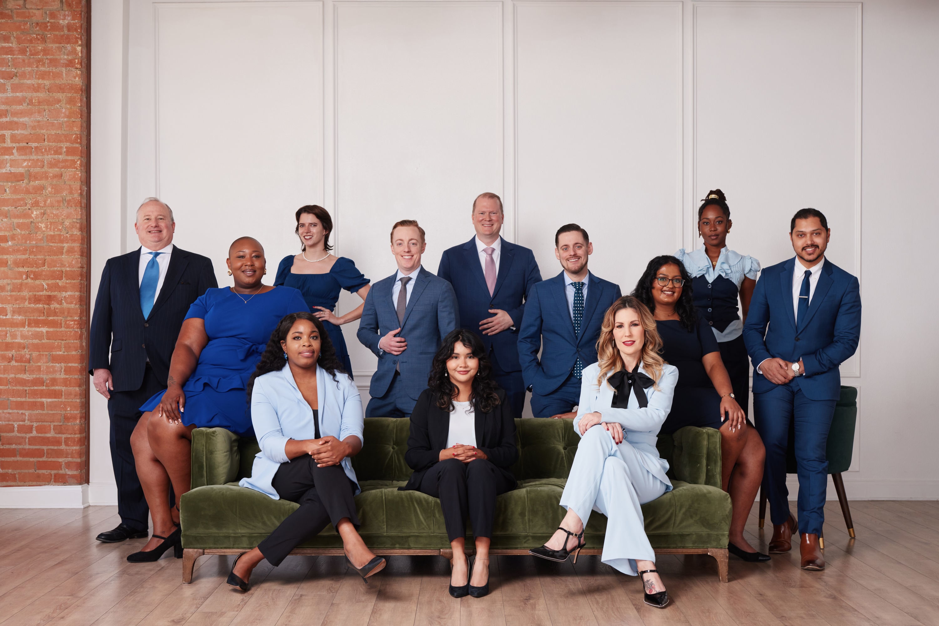 The DebnamRust, P.C. team posing together in a professional group photo.
