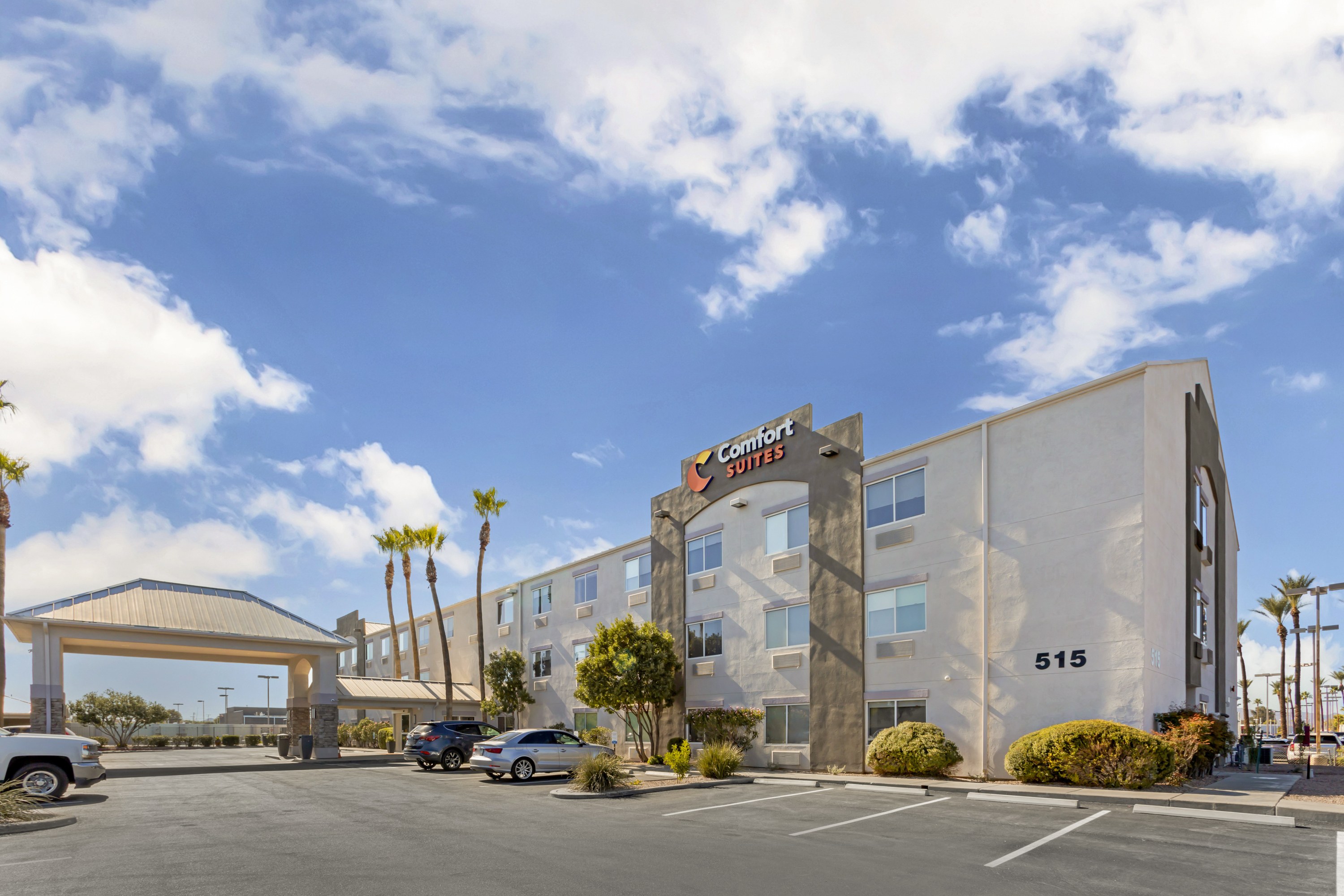 Exterior view of Comfort Suites at Tucson Mall, a modern, all-suite hotel with a welcoming entrance.