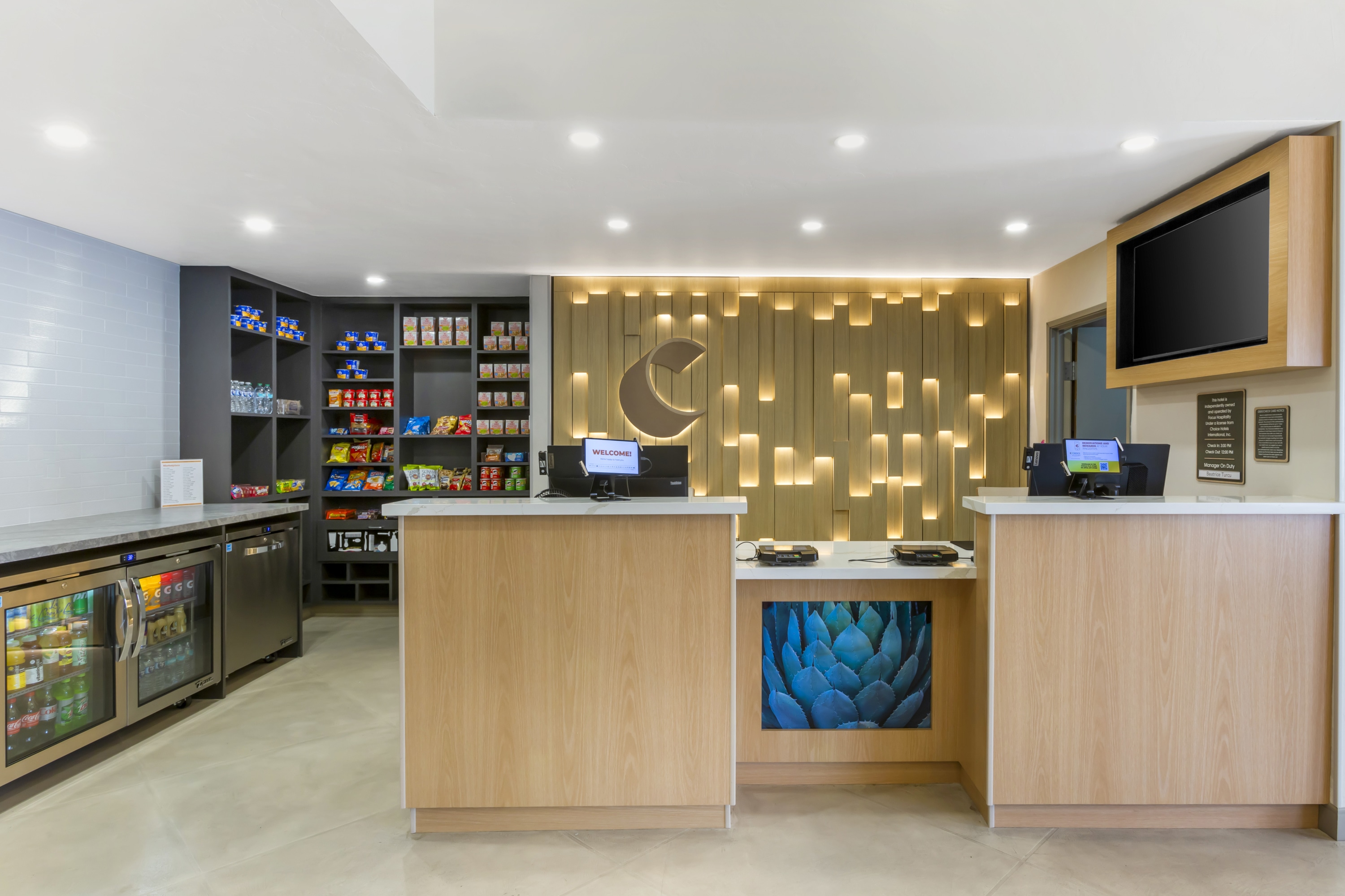 Front desk area at Comfort Suites Tucson Mall with friendly staff.