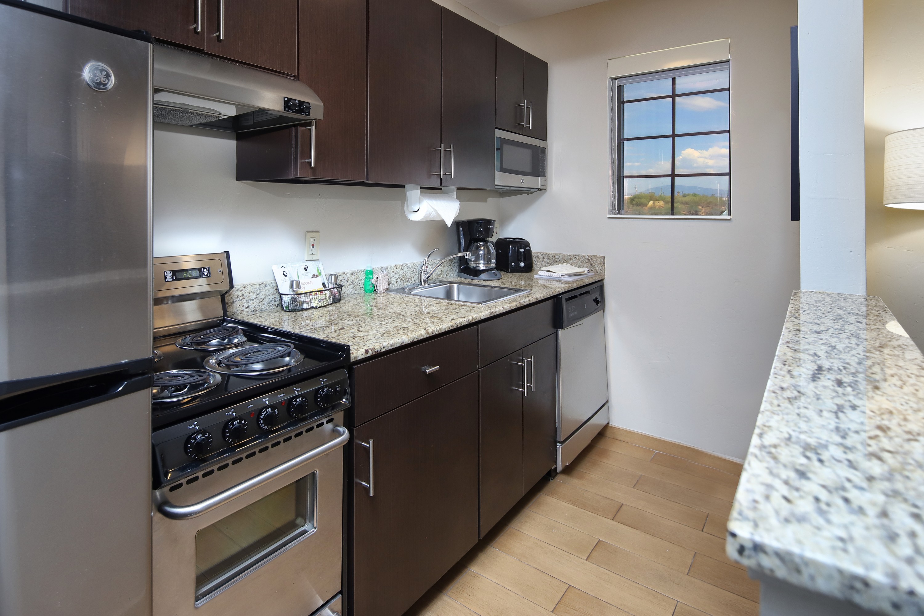TownePlace Suites Tucson in-suite kitchen with full appliances and dining area