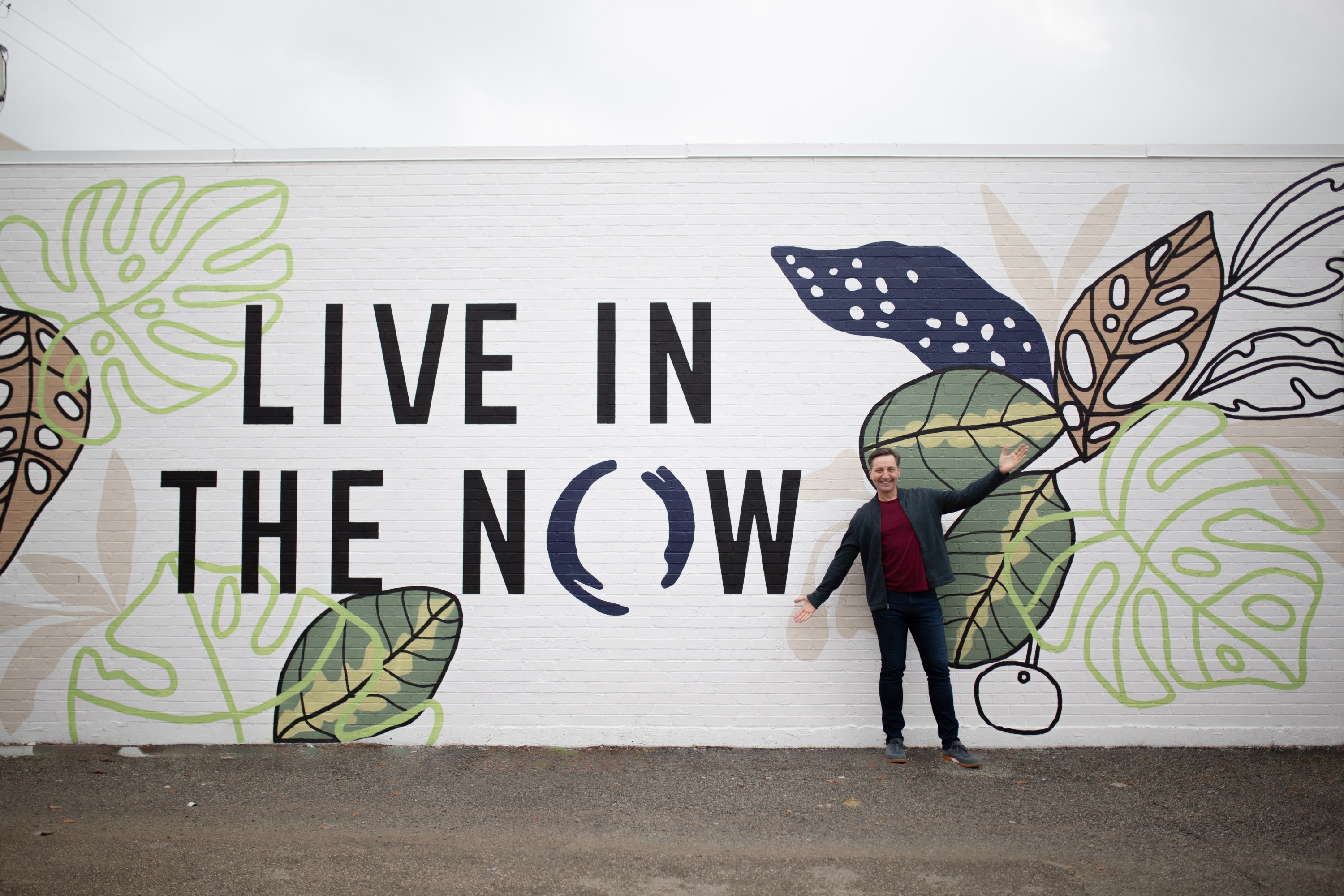 Live in the NOW mural at The NOW Massage Oak Lawn Dallas with greenery design