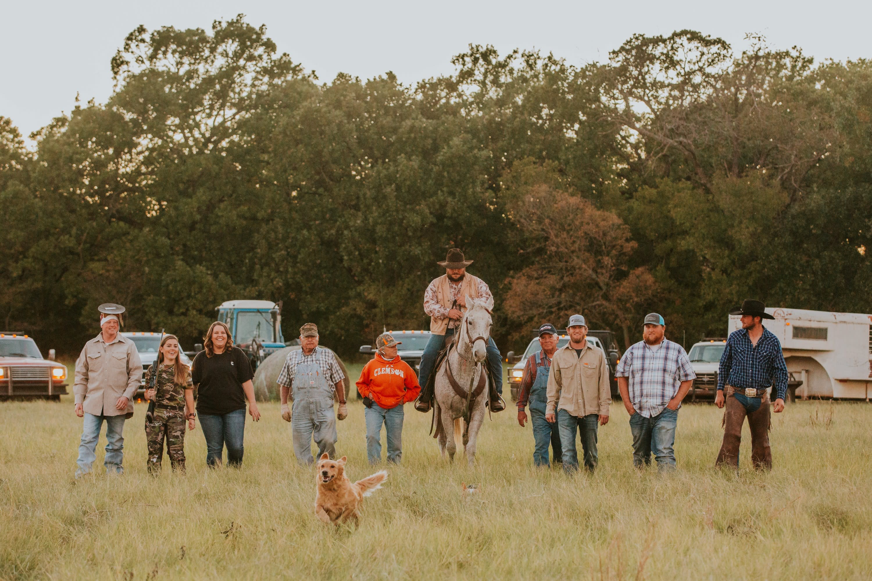 Group of tradesmen, hunters, mothers, farmers, rancher, dressed in work clothes walking towards the camera