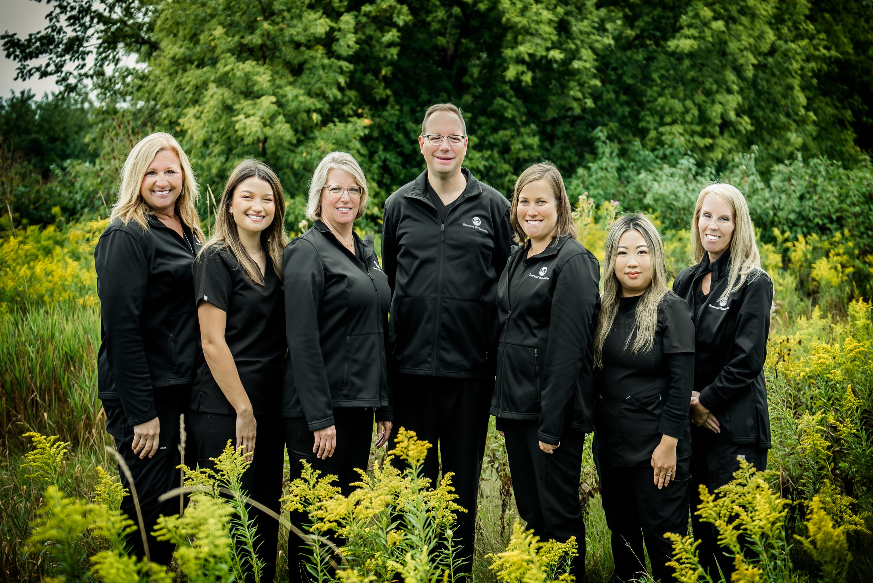 This is our updated team photo- the amazing crew behind the smiles at Deerwood Orthodontics! 🦷✨💗
