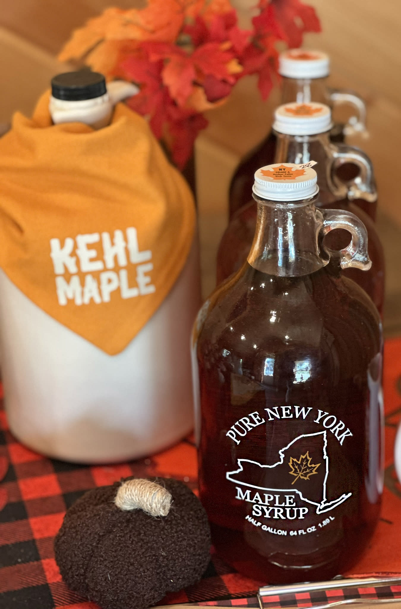Photo of three half gallon bottles of maple syrup