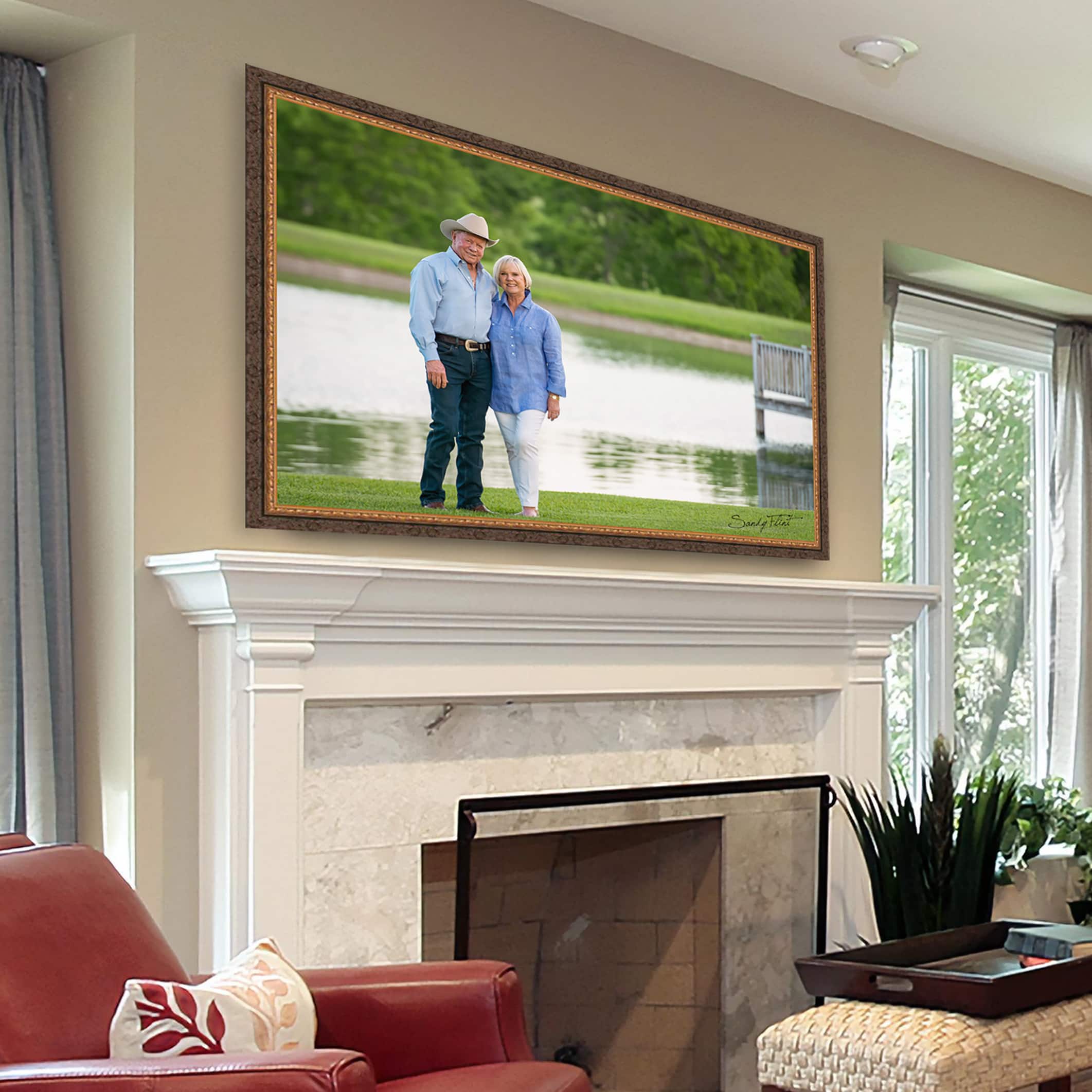 Beautiful couple's portrait displayed above the fireplace made in Chappell Hill, Texas