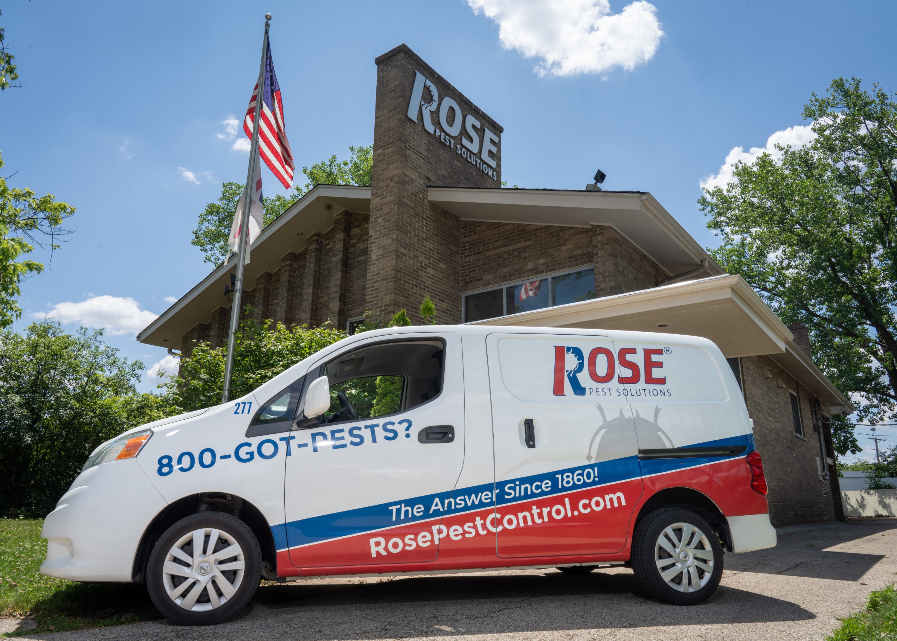 Rose Pest Solutions vehicle in front of headquarters in Northfield, IL