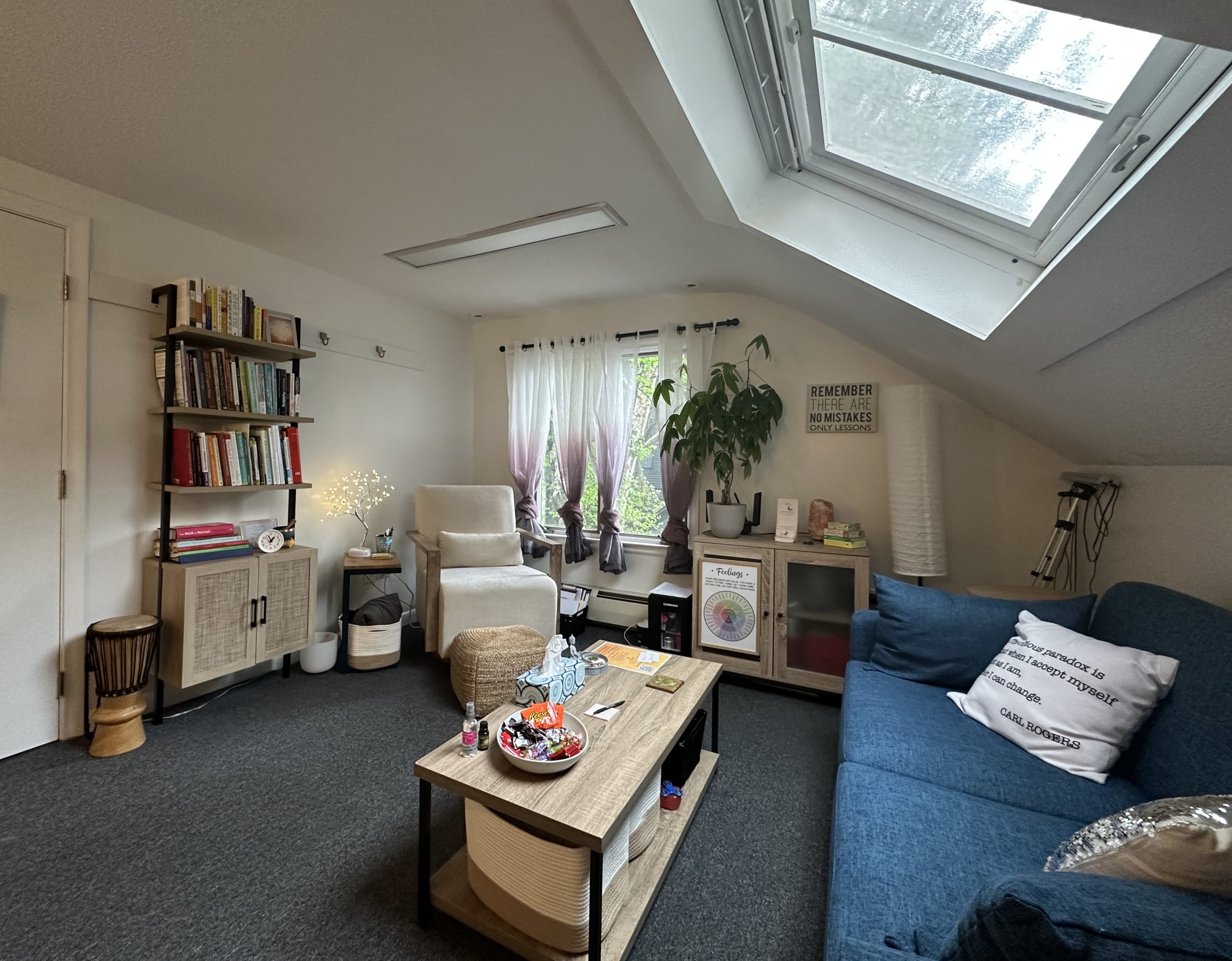 office for Instar Healing at 304 Main Streets bookcase, chair, couch, coffee table