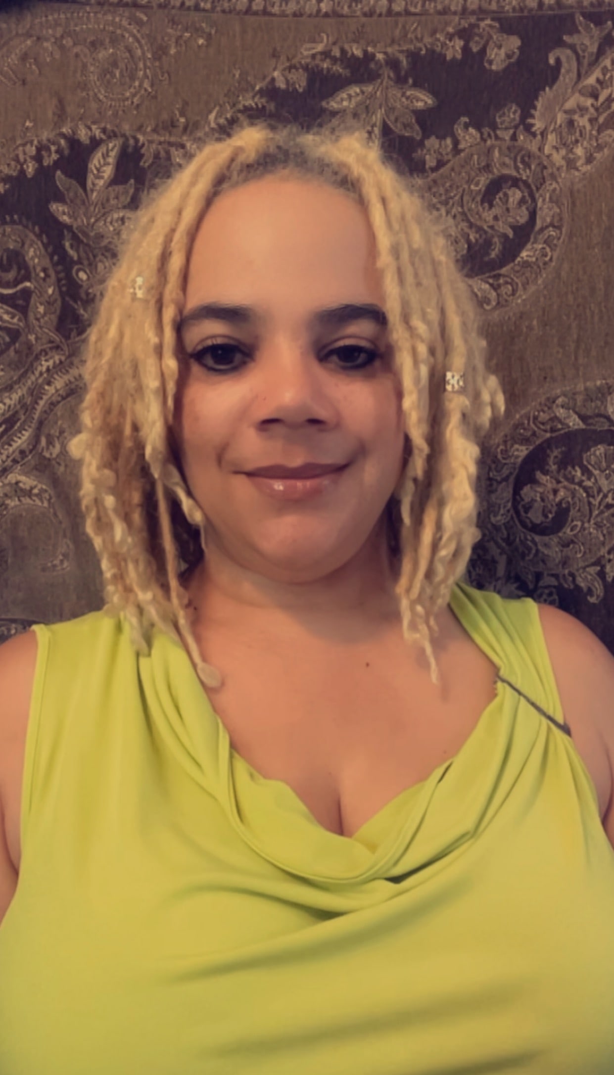 Middle Aged Bi-racial woman with blond dreadlocks