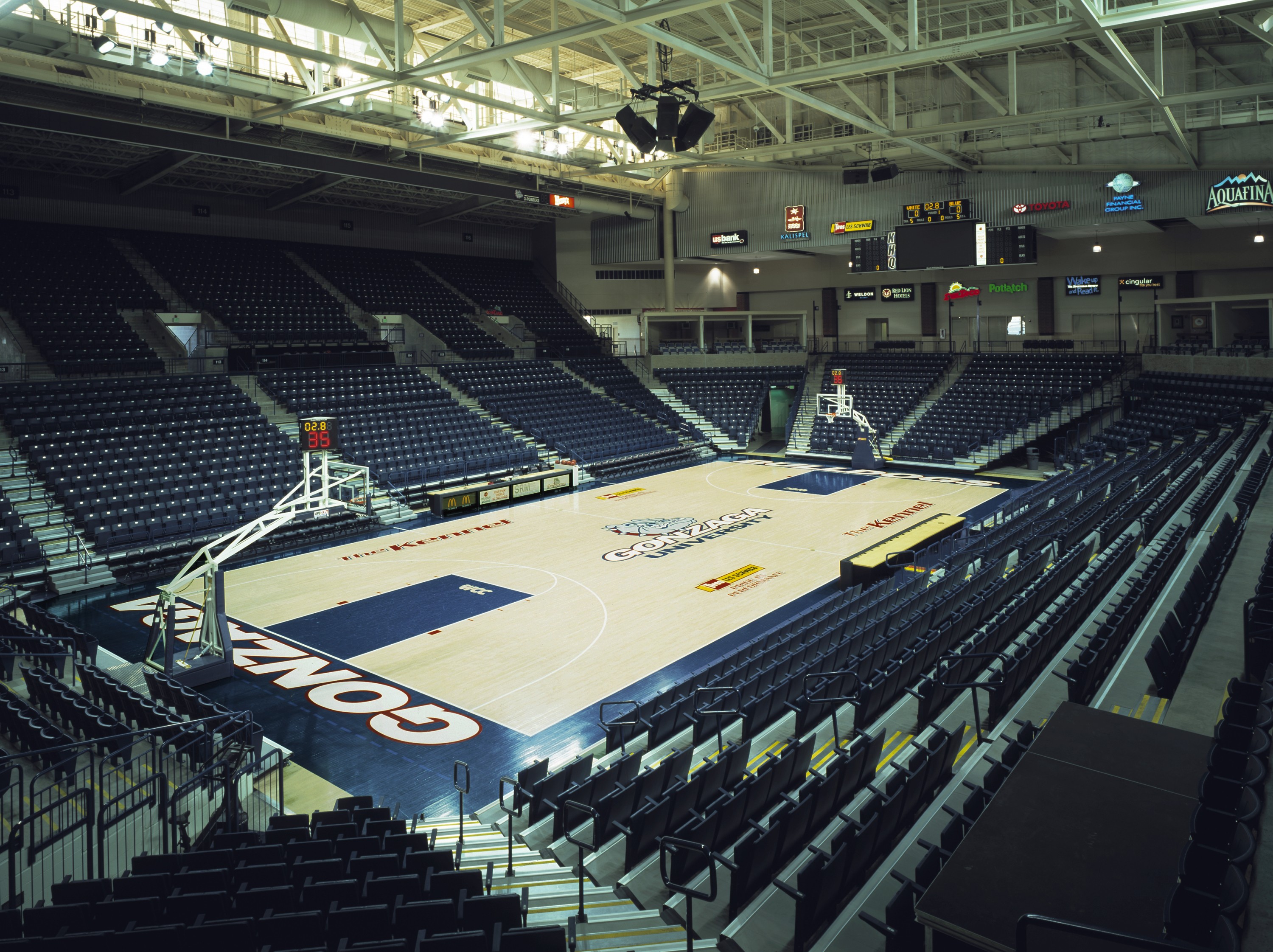 Inside building looking to center basketball court from upper seats