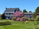 The Bradley Inn in the spring with beautiful flowering tree in full pink bloom