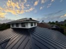 Metal roof installation completed by Mighty Fine Roofing on a home in Naples, Florida