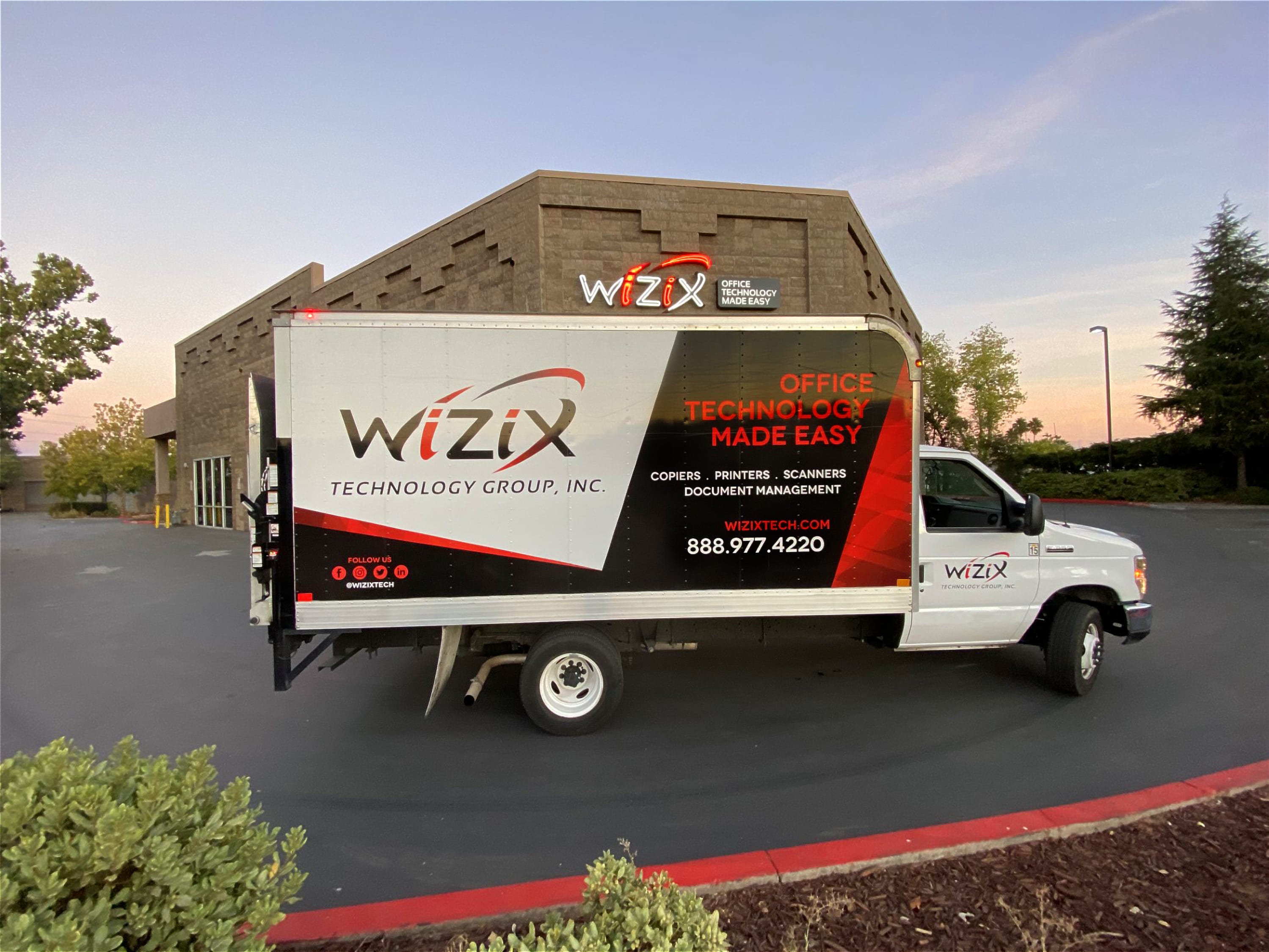 WiZiX service and delivery truck parked outside of local WiZiX headquarters during sunset