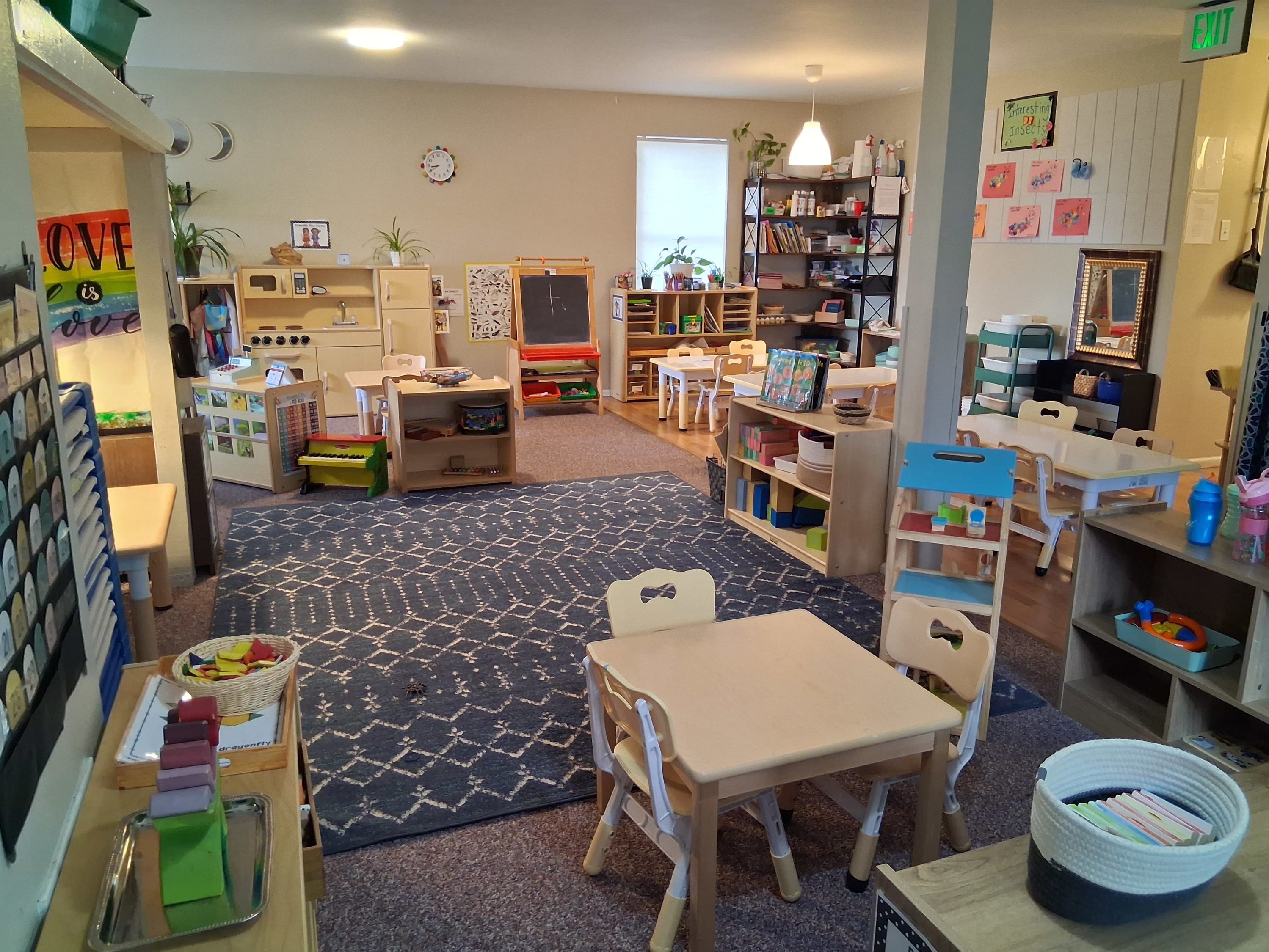 A child care classroom filled with furniture and materials