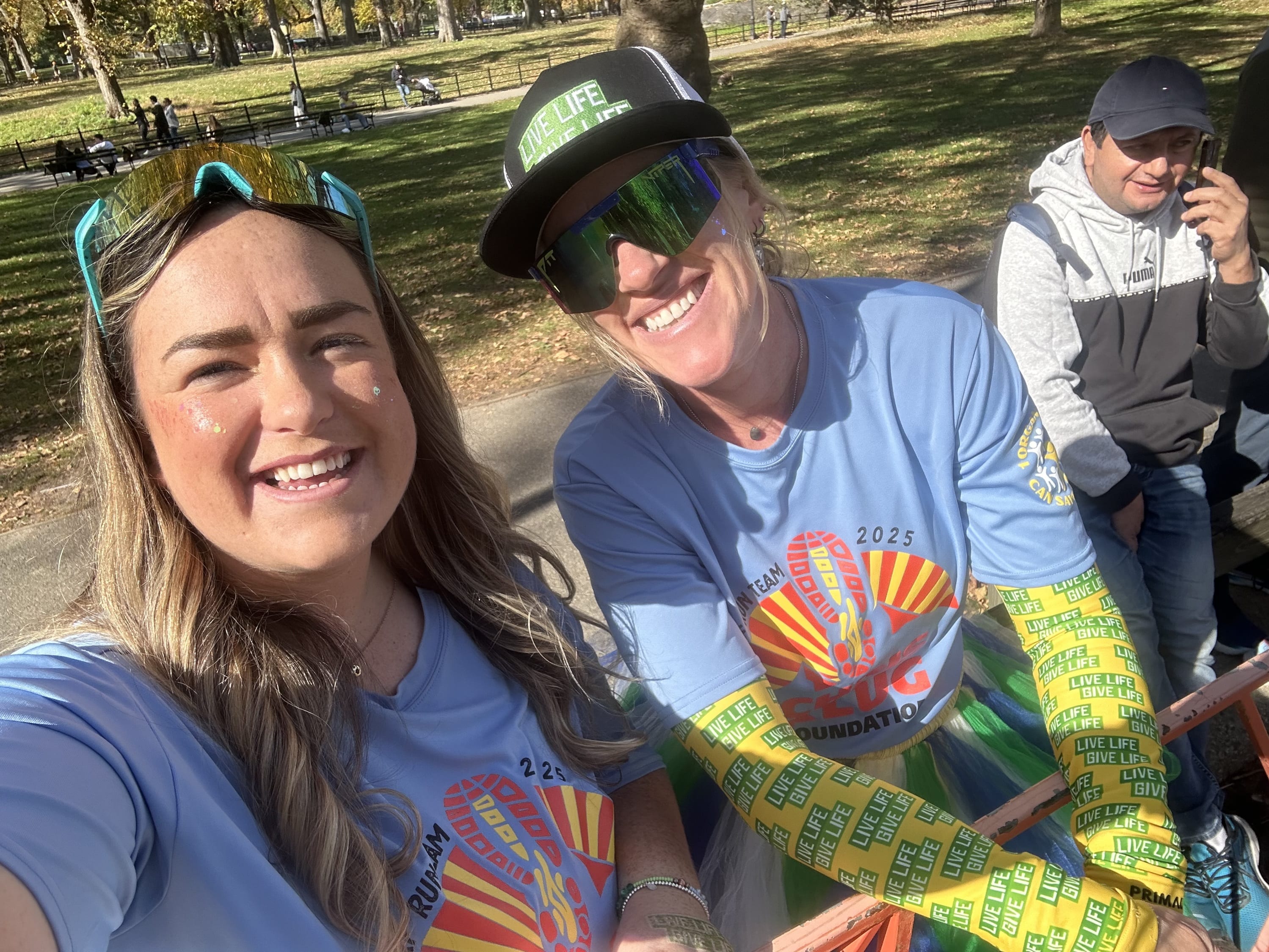 two women smiling for the camera wearing CKF branded apparel