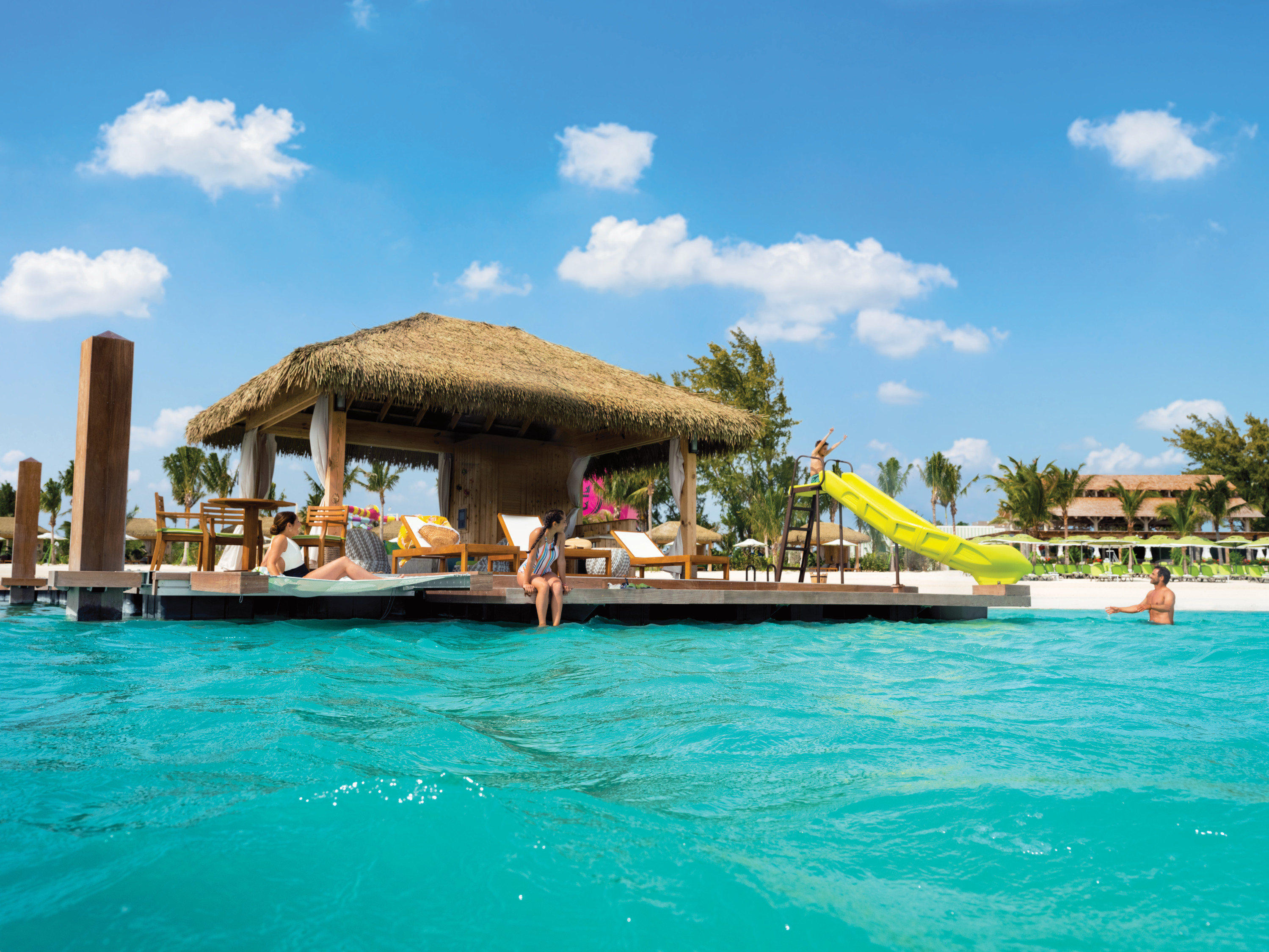 Luxury aluminum floating dock platform designed by MAADI Group at Coco Beach Club, CocoCay – featuring overwater cabanas