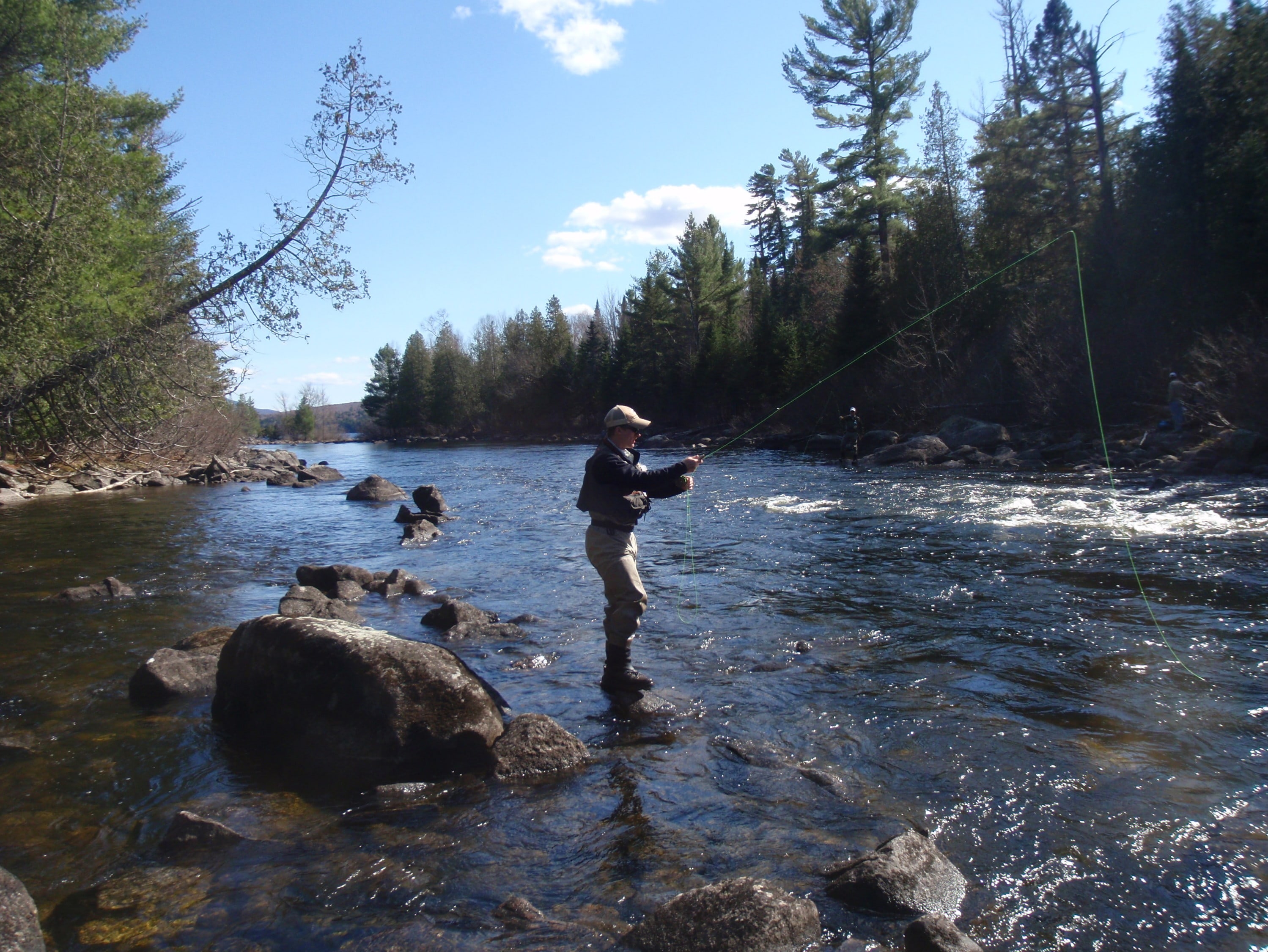 a fisherman on the Rapid River