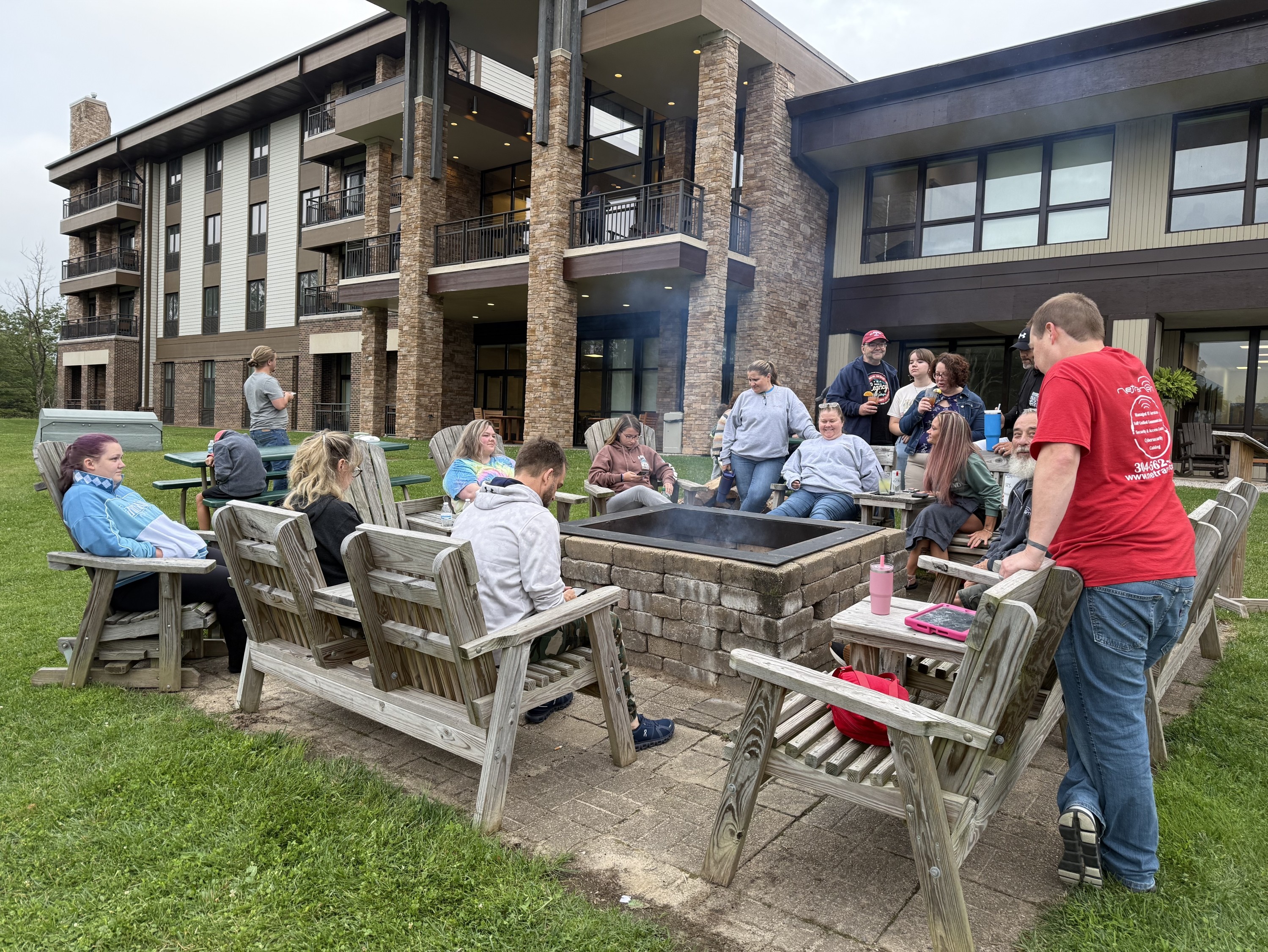 Netranom team enjoying evening firepit gathering at Canaan Valley Lodge
