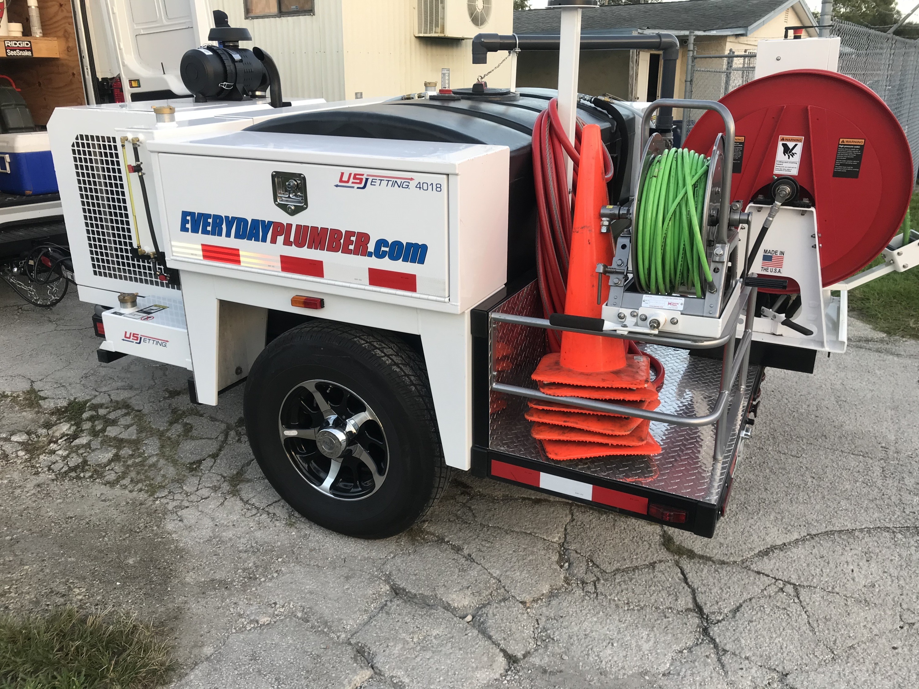 EVERYDAYPLUMBER.com hydro jetting trailer with US Jetting 4018 hose reels for drain and sewer cleaning in Tampa Bay