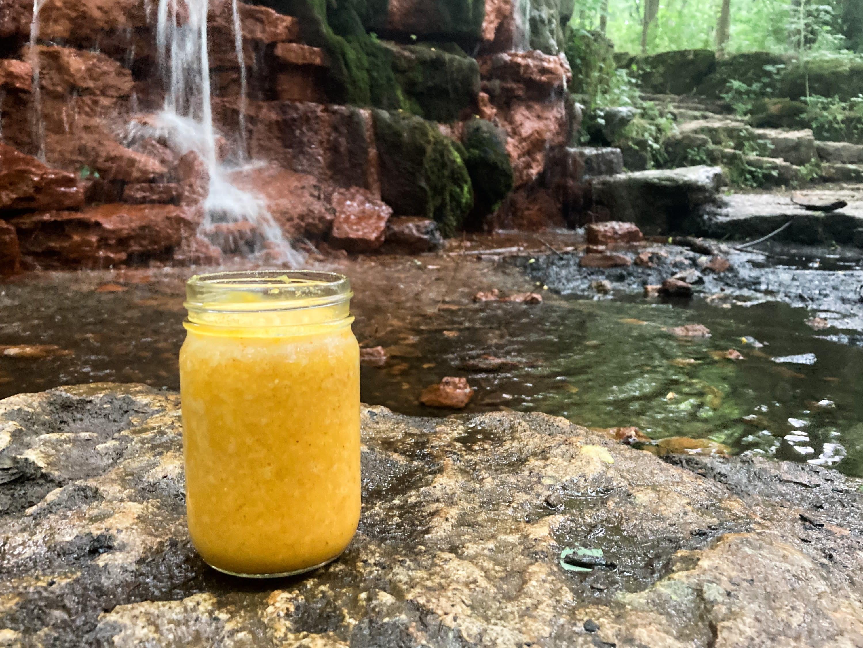 Yellow Springs Elixir Smoothie in front of the Yellow Spring
