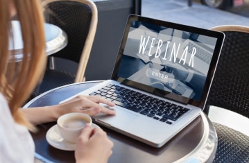 Image of woman attending webinar