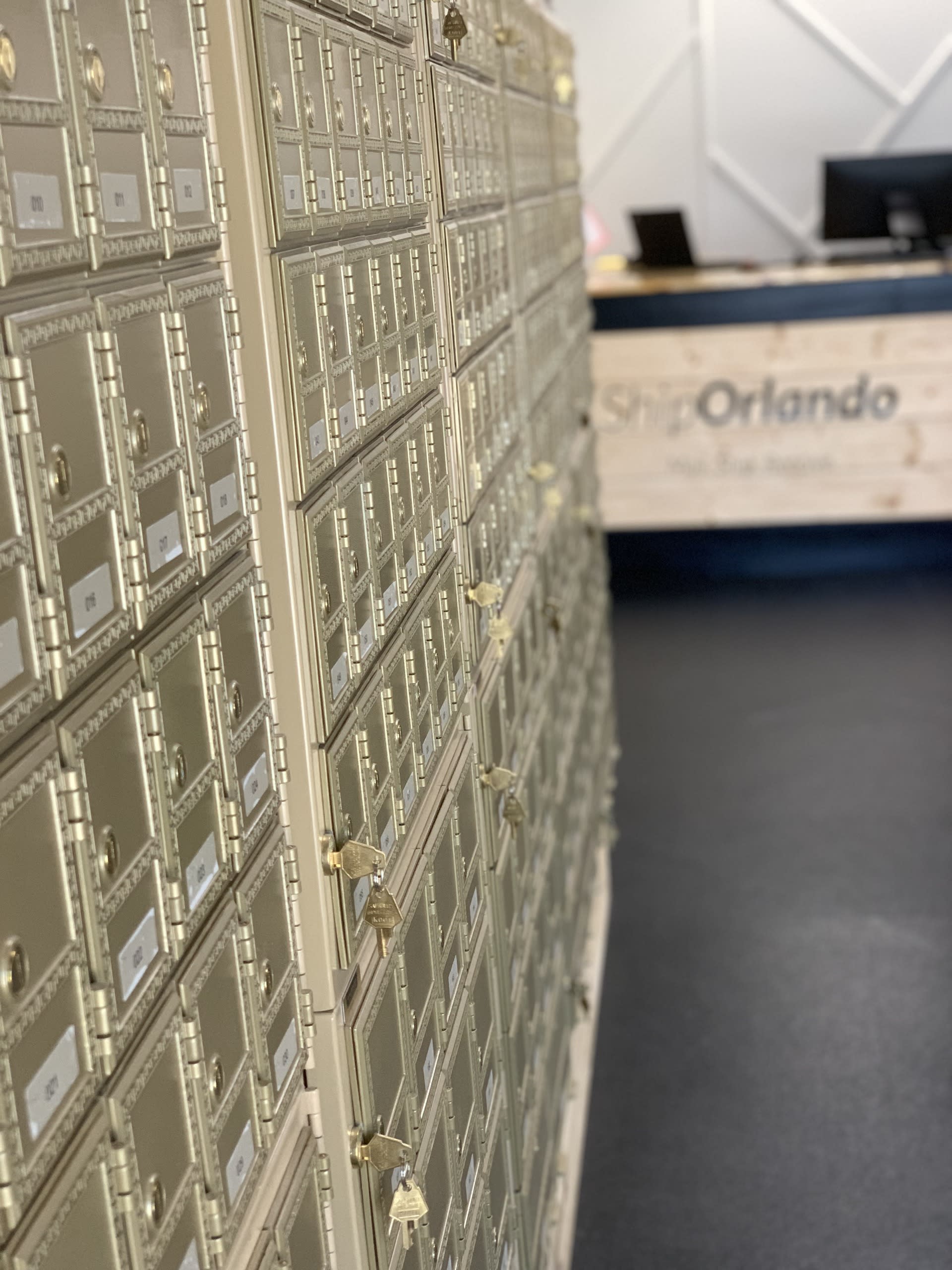 Rows of private mailboxes at Ship Orlando, indicating options for virtual mailbox services and physical business addresses.