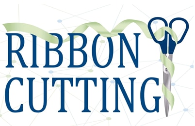 a green ribbon threaded through the word Ribbon with scissors