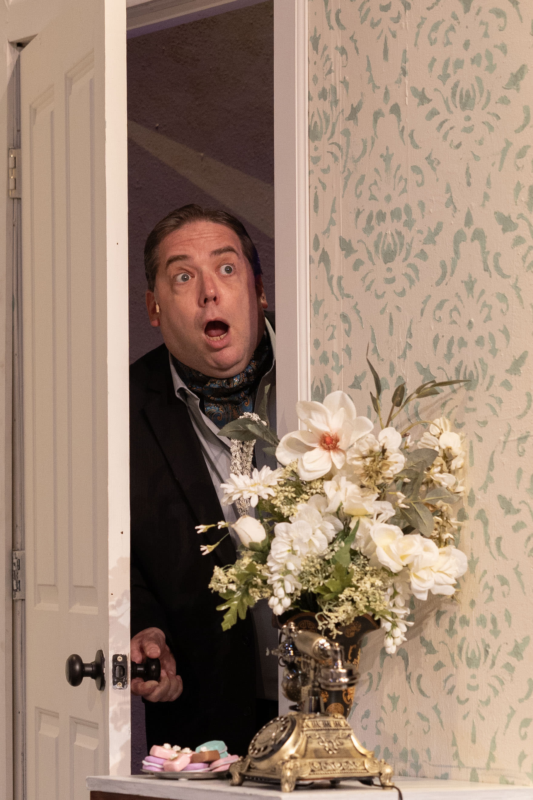 Tito Moreli listens at the door