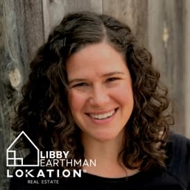 Libby Earthman, REALTOR with LoKation Real Estate, smiles while looking into the camera.