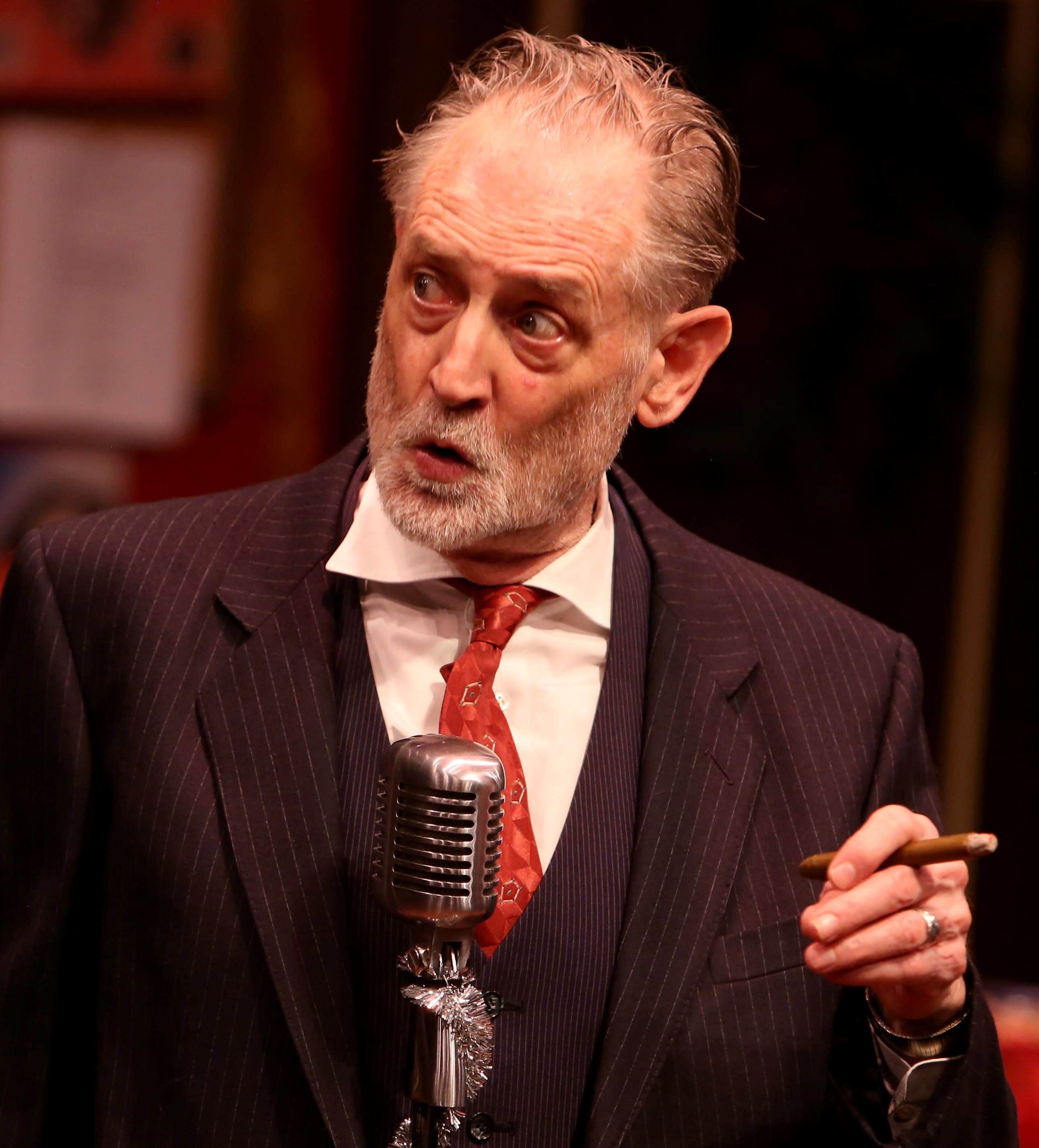 an actor at a microphone